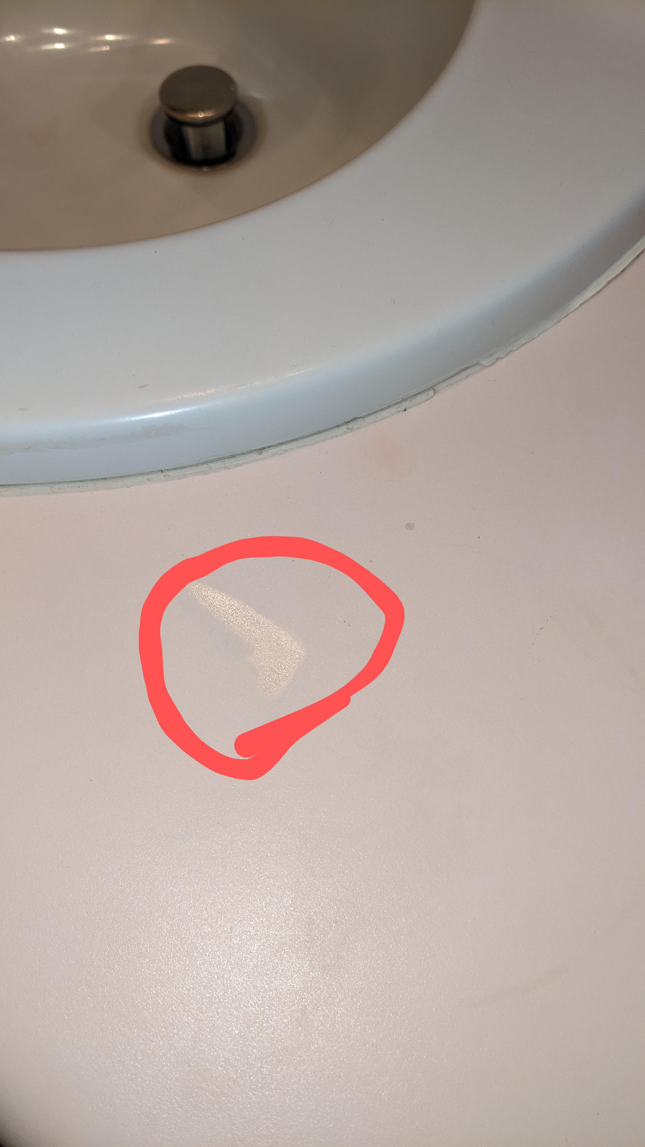 this spot on my bathroom counter that looks like a small puddle of