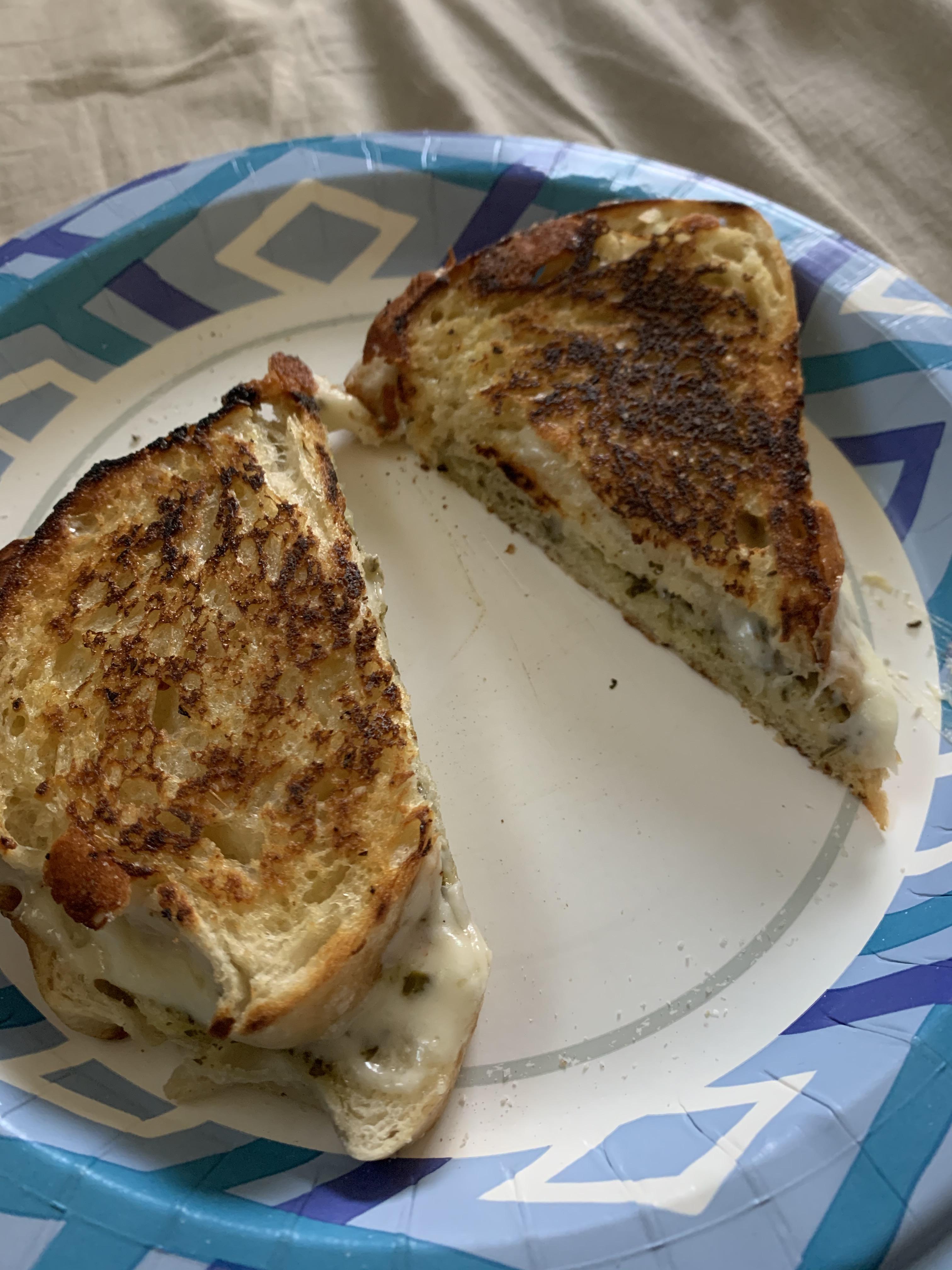 Pesto, provolone, and pepper jack grilled cheese with Jane’s Mixed Up