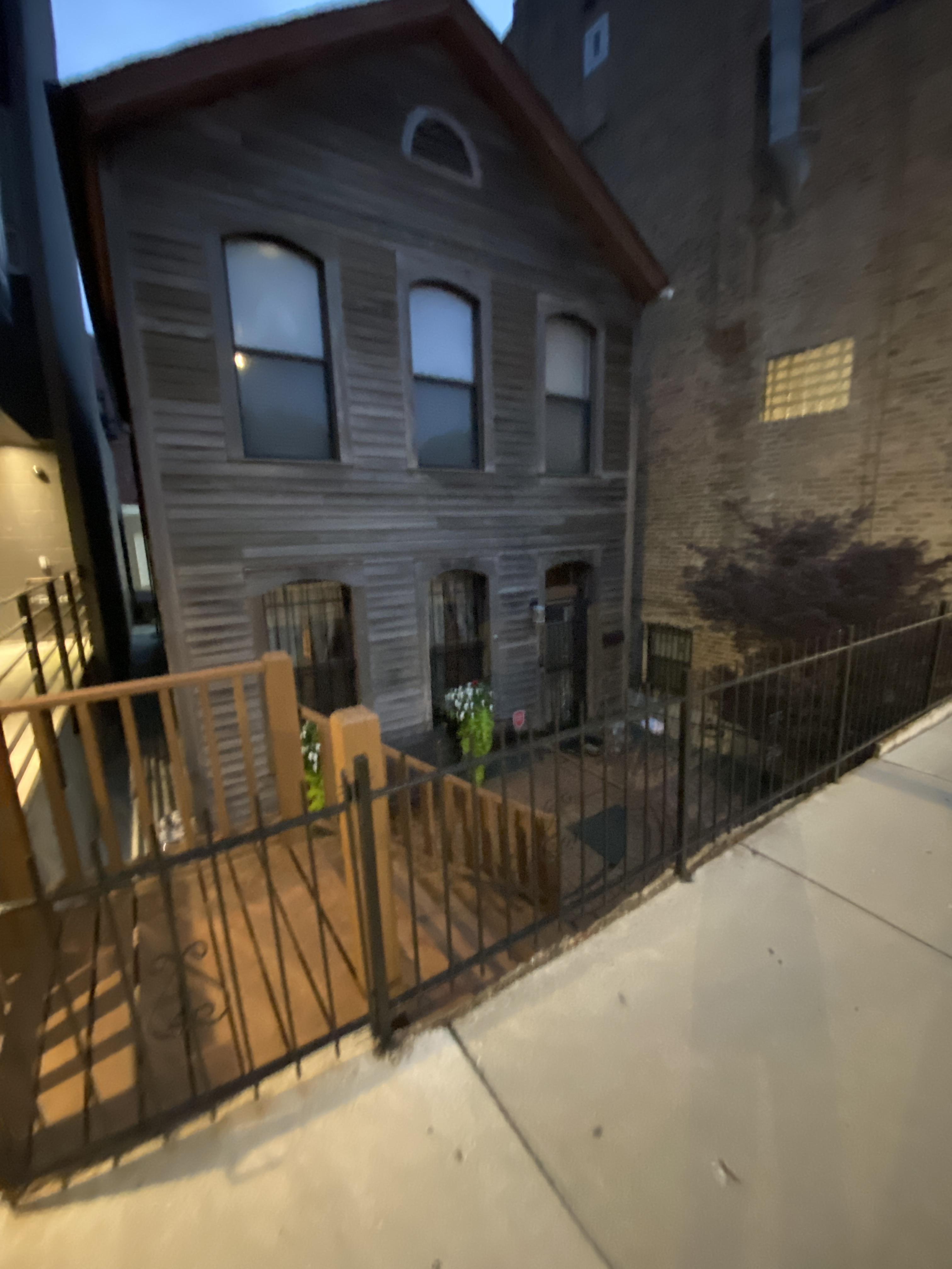 Old house way below street level example guessing late 1800s r/chicago