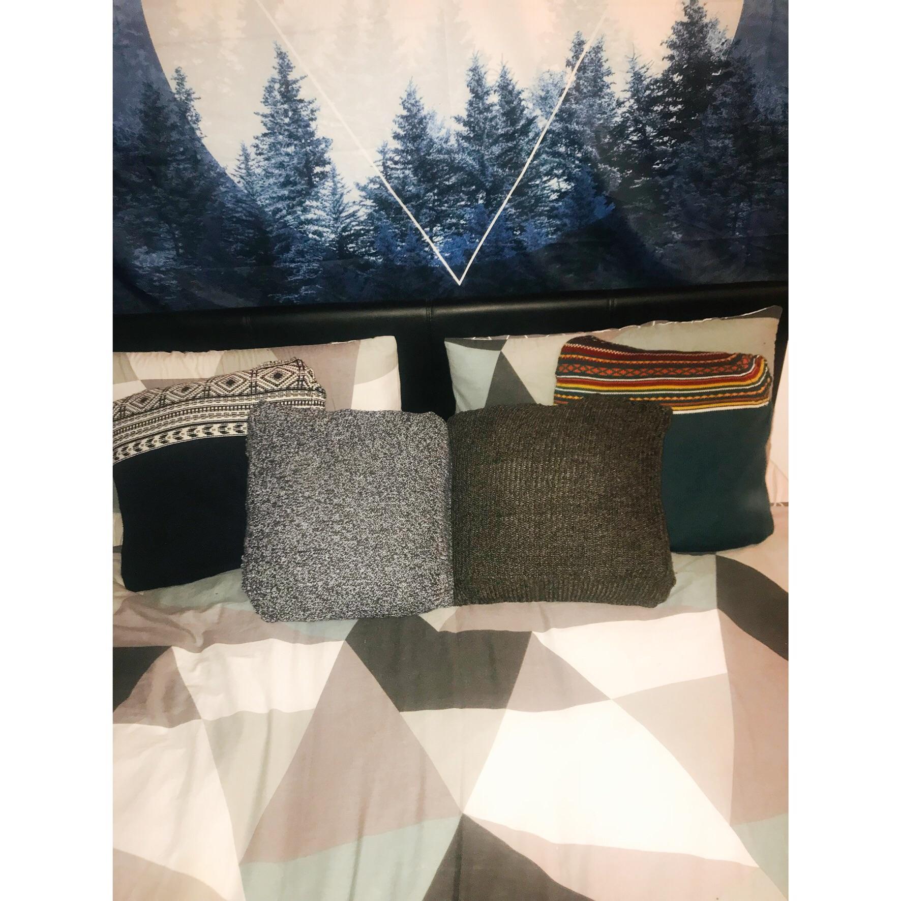 Cushion covers made from my boyfriends old jumpers he was going to