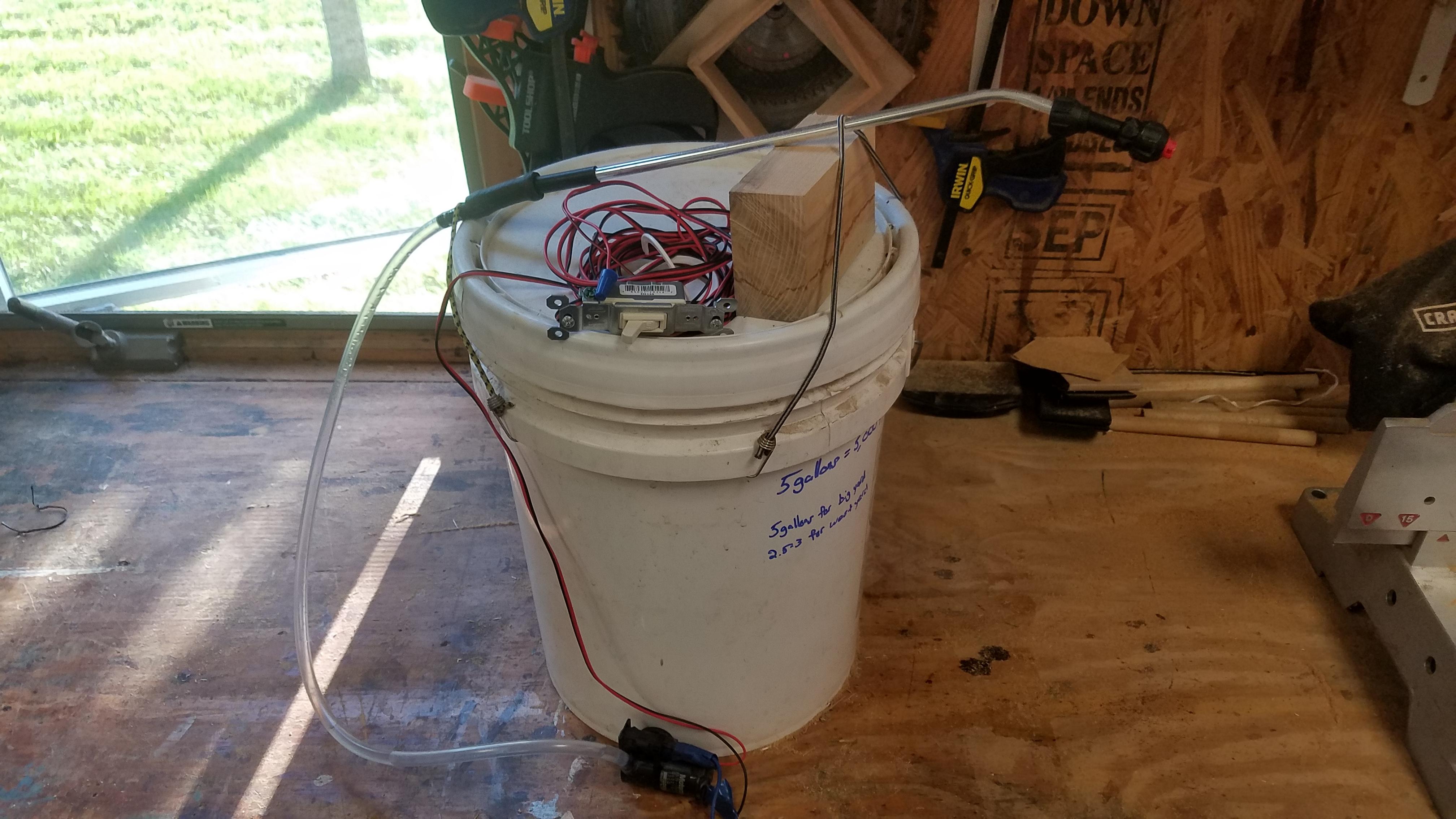 A tighter shot of my DIY yard sprayer. Windshield washer pump, spray