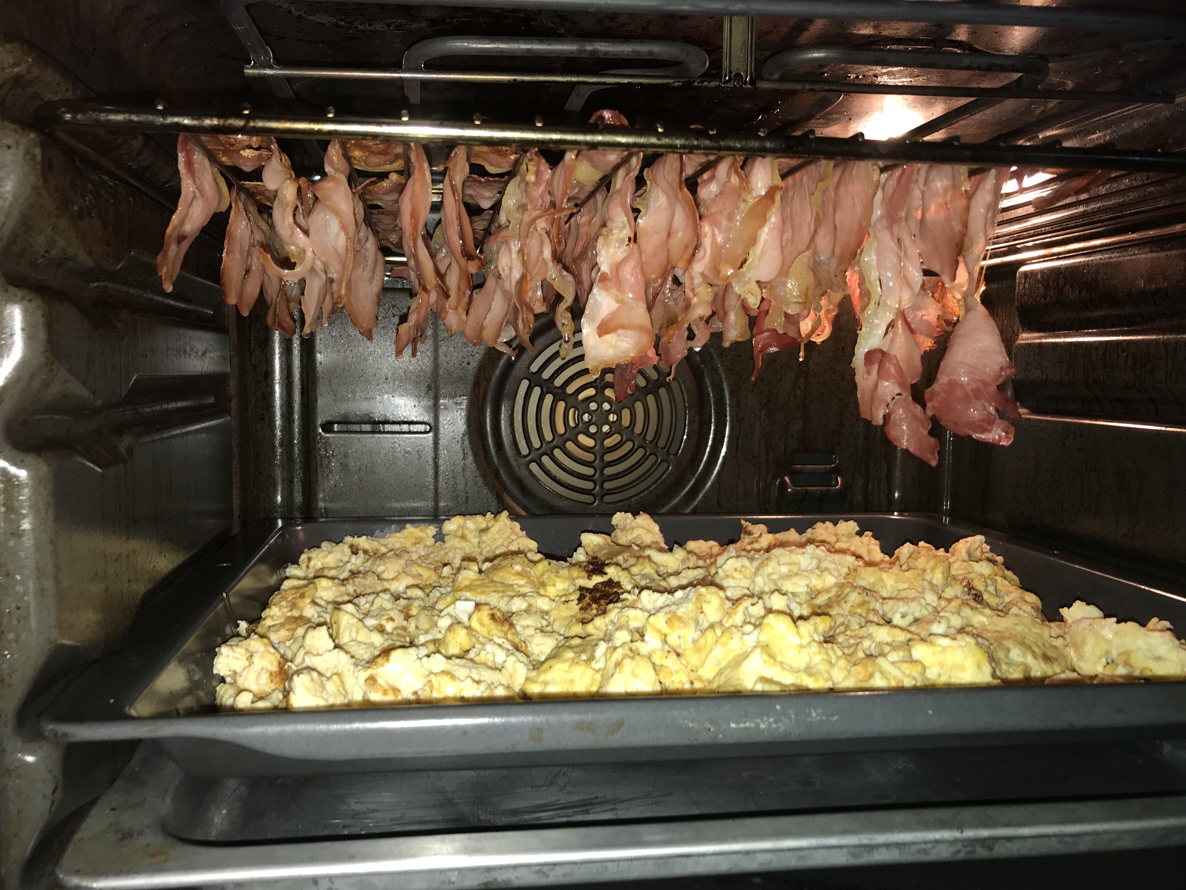 Use the oven to keep your scrambled eggs warm and roast bacon at the