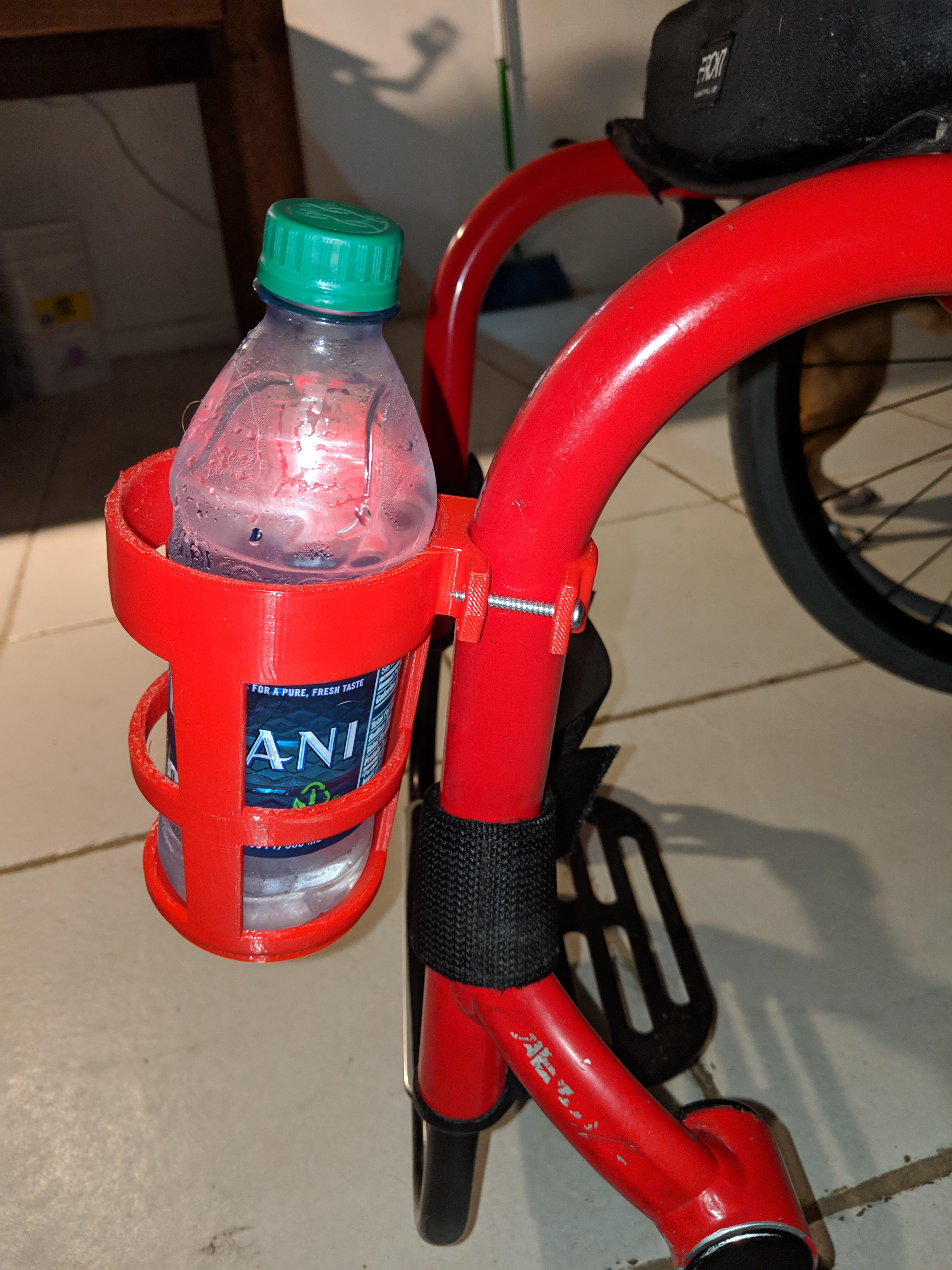 This custom cup holder for my wheelchair perfectly explains why 3D printing is so important. r