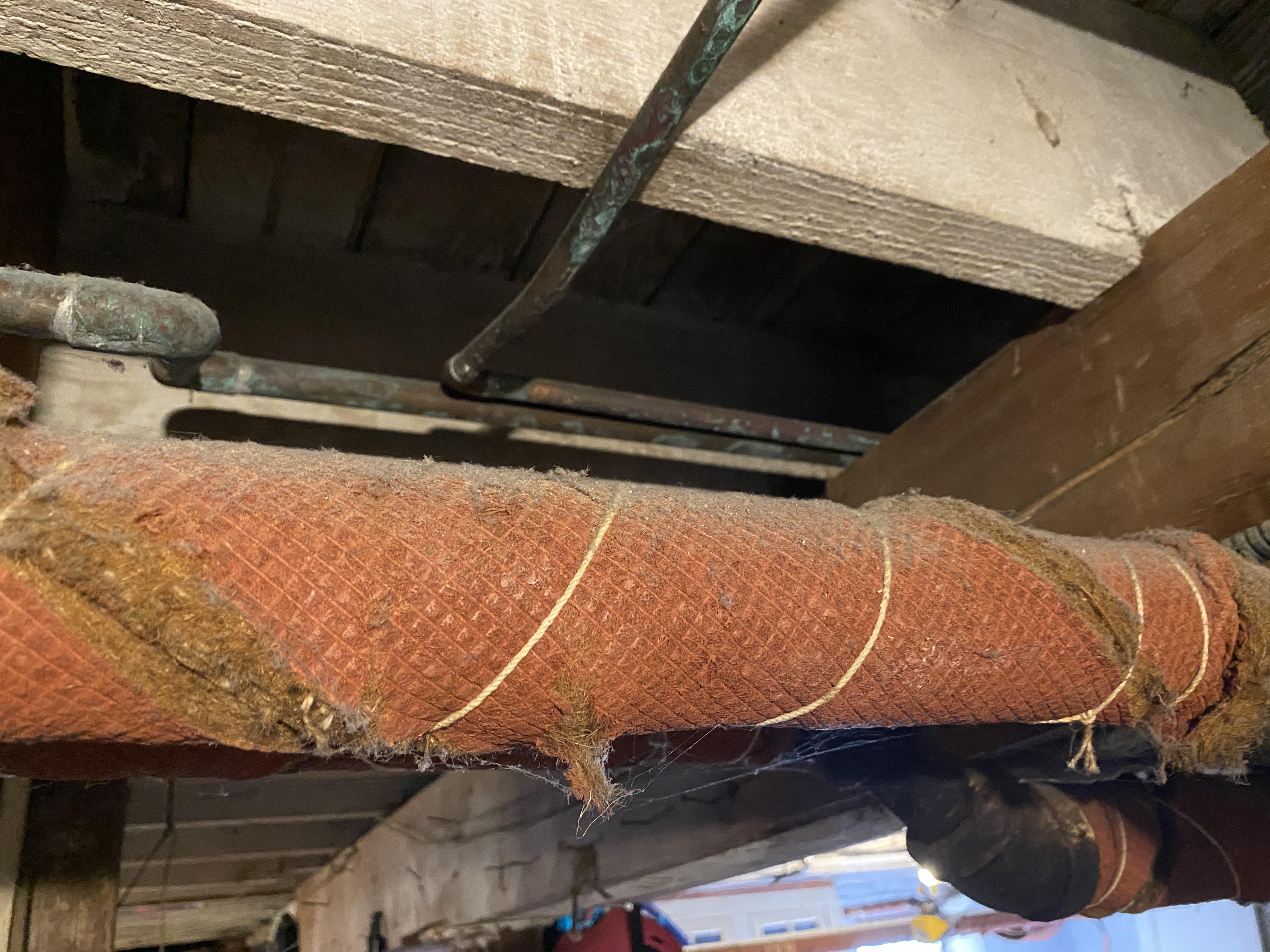 Some sort of insulating wrap around my house’s radiator pipes. Asbestos