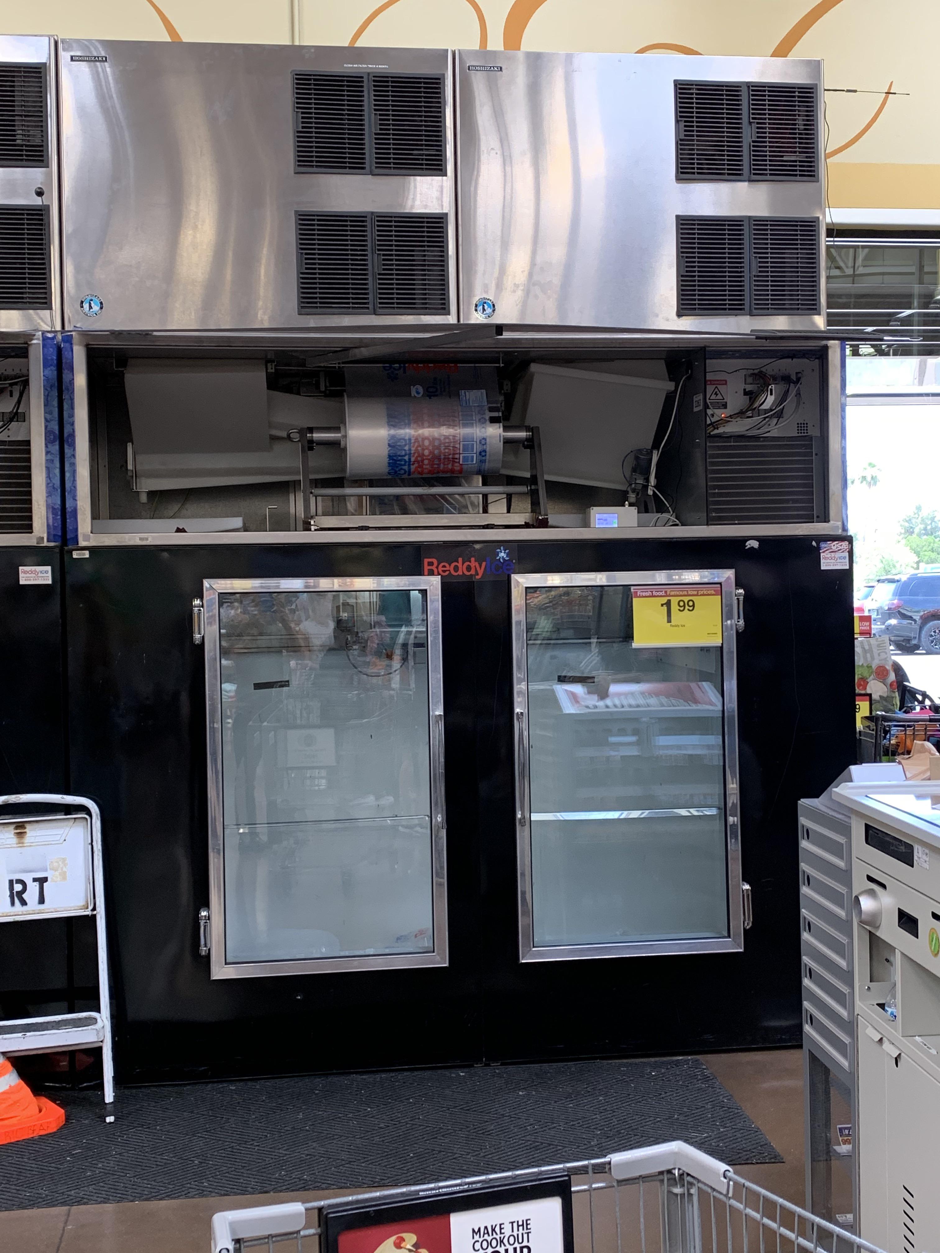 This Reddy ice cooler has a machine that makes and packages ice, on top