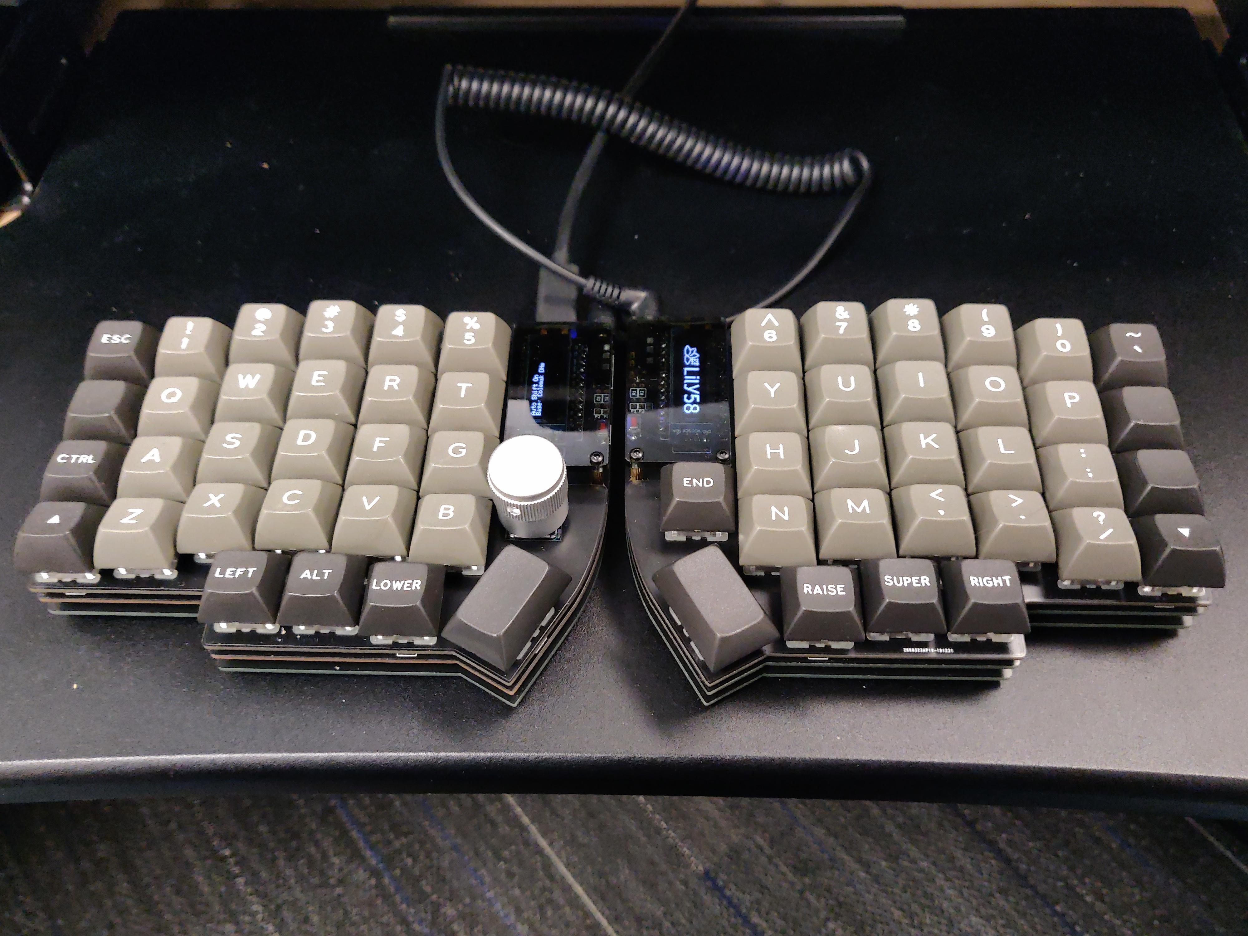 Lily58 Pro, with MX and Choc sockets, a rotary encoder, OLED's, and