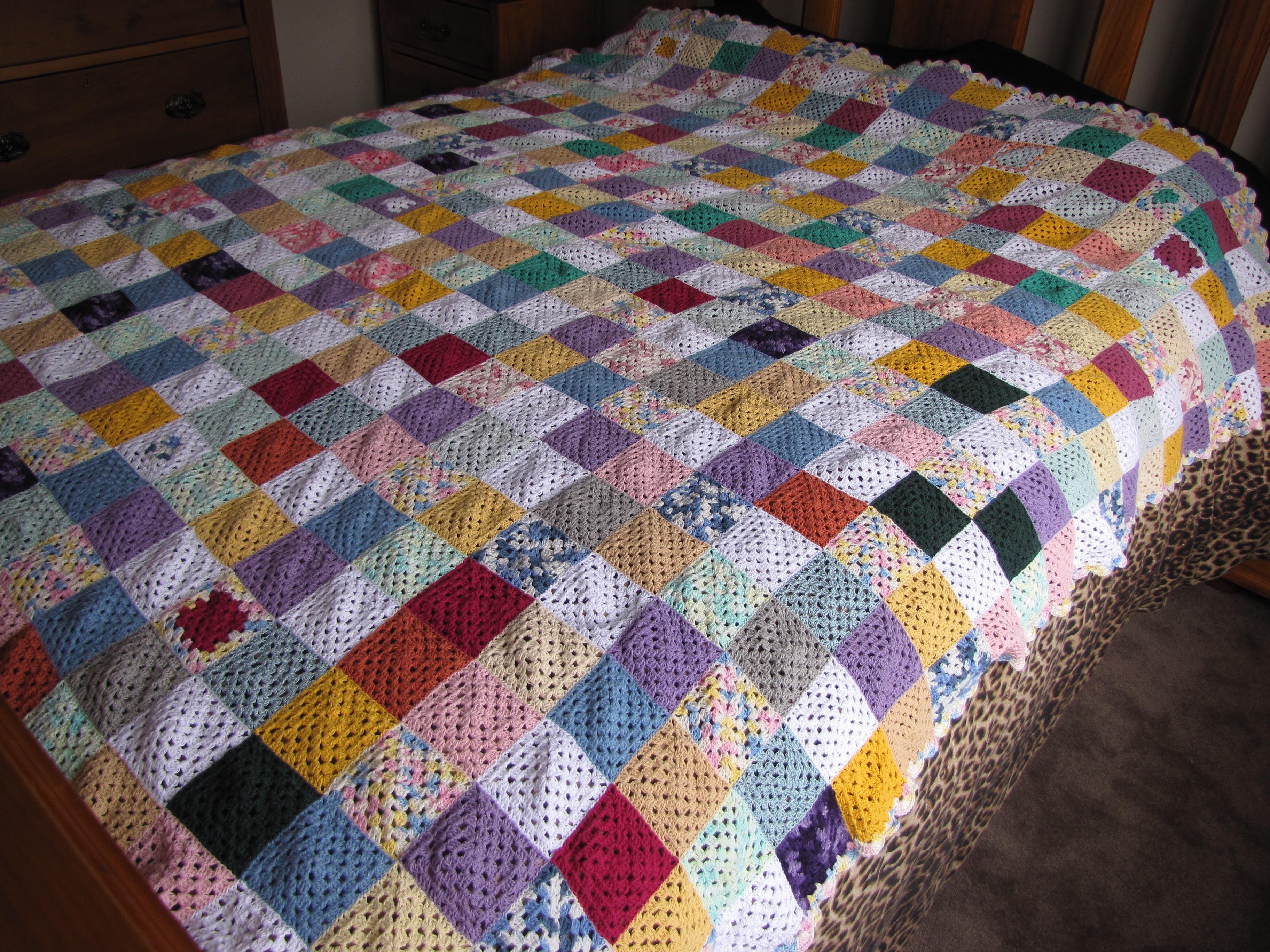 A blanket crocheted with crochet cotton and sewed together with
