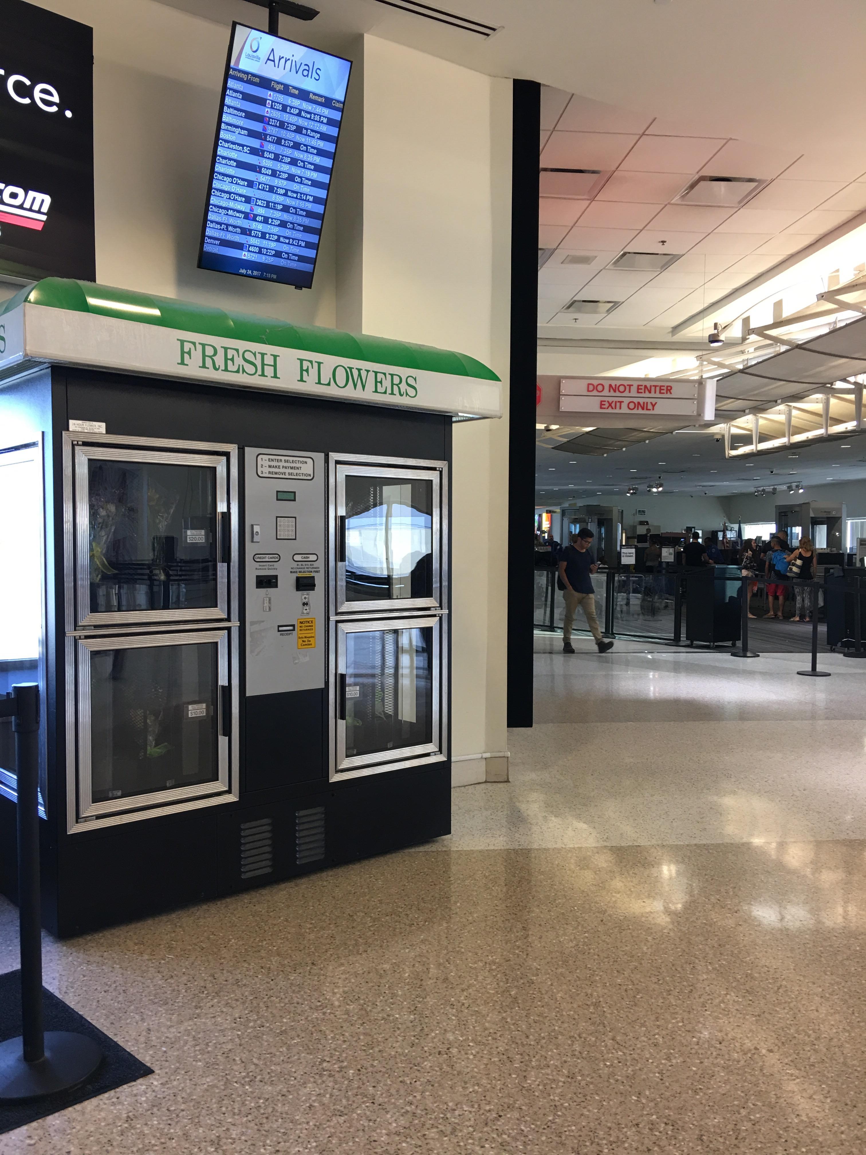This flower vending machine in the airport by arrivals. r