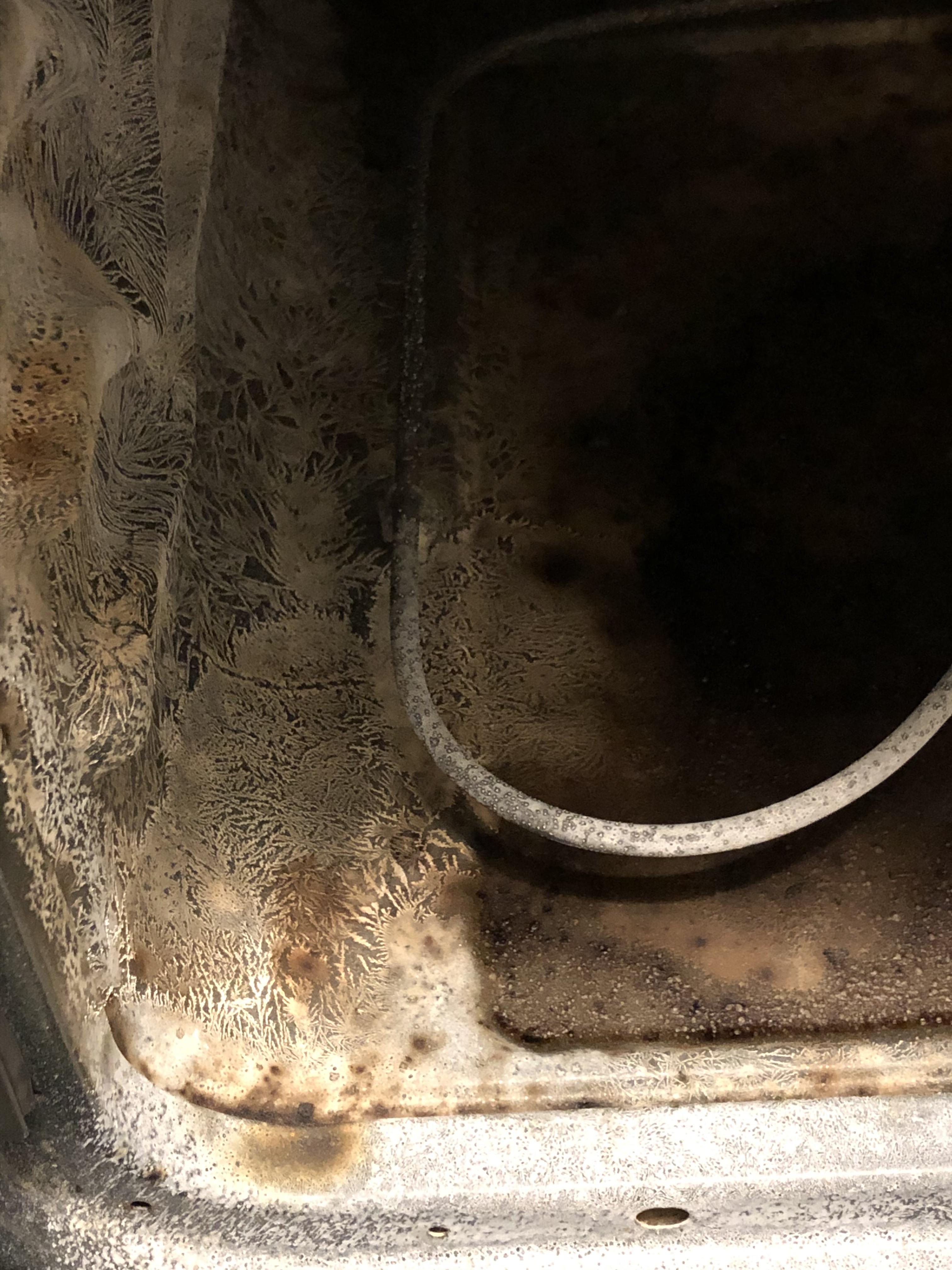 What is this weird white crystalized/frosty looking residue inside the