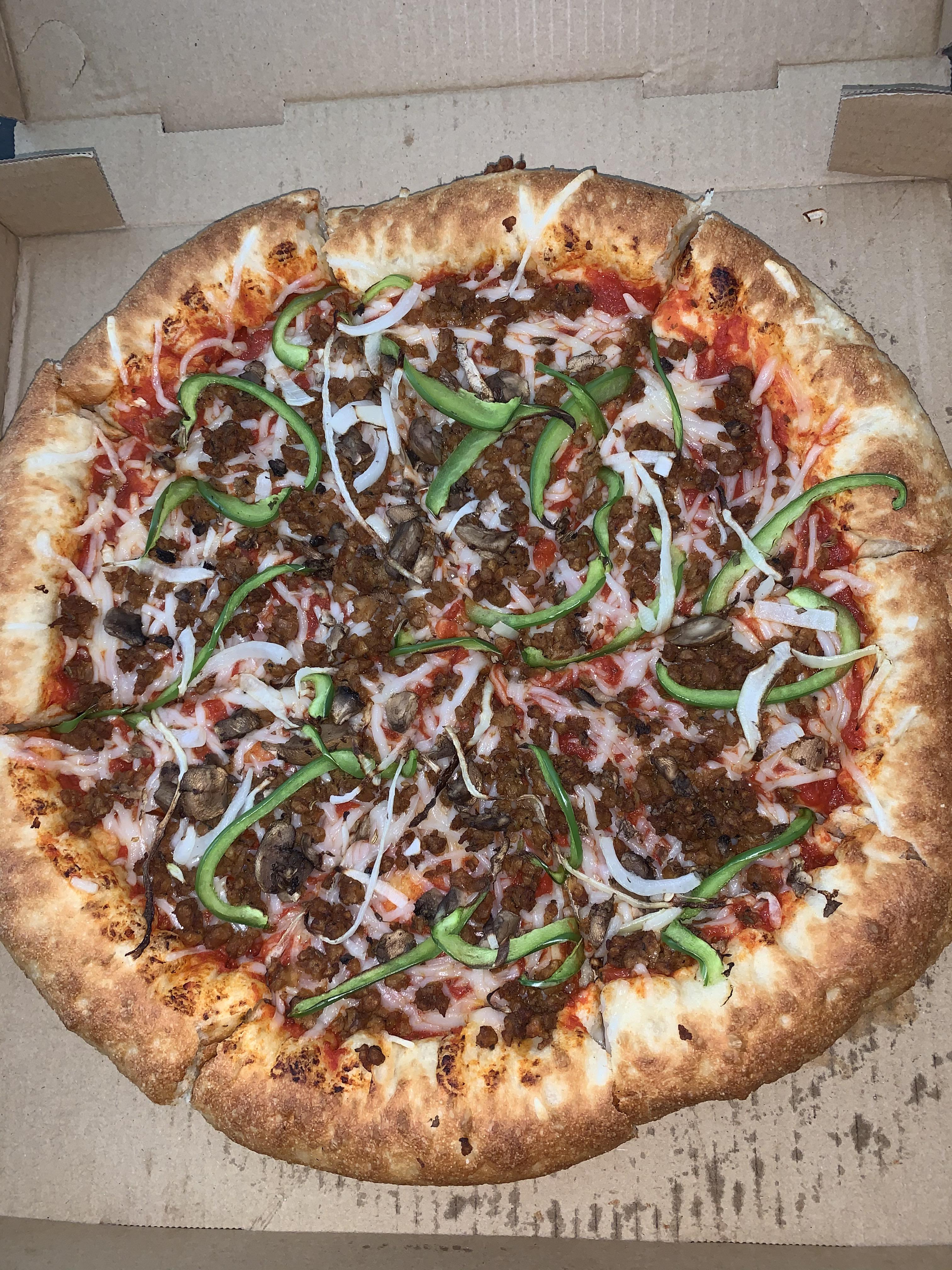 Vegan stuffed crust pizza with Beyond sausage crumbles from Perfect Pizza in San Diego, CA r