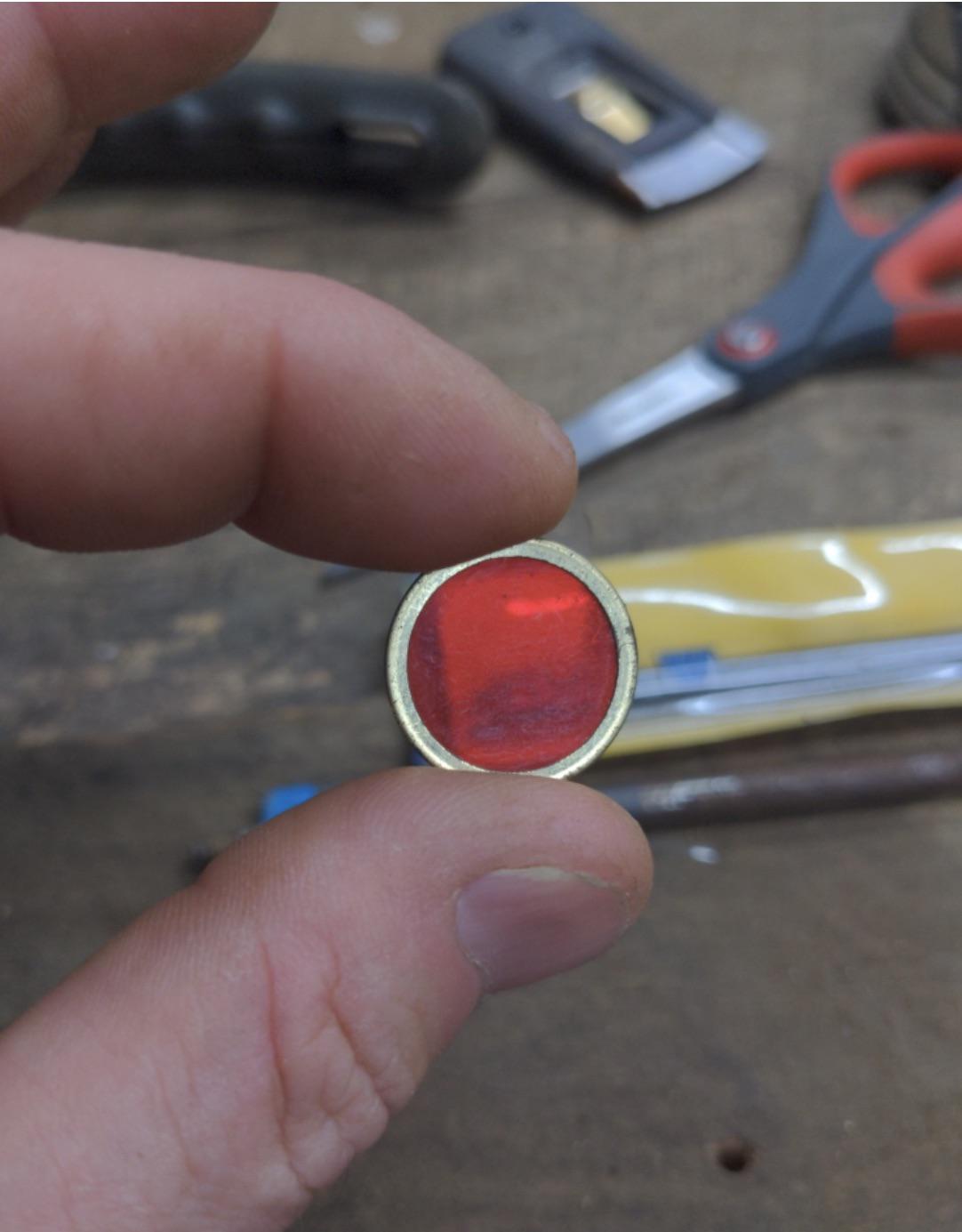 Little red dot, metal border. No idea other than that? r/whatisthisthing