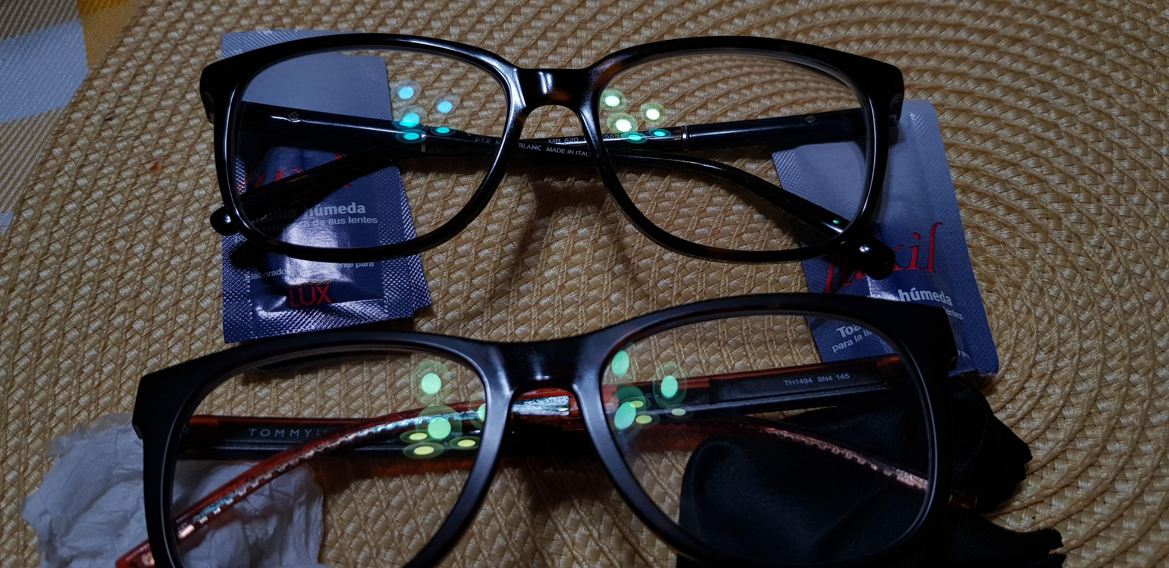 Why does my new eyeglasses (top) have a blue reflection (left lense