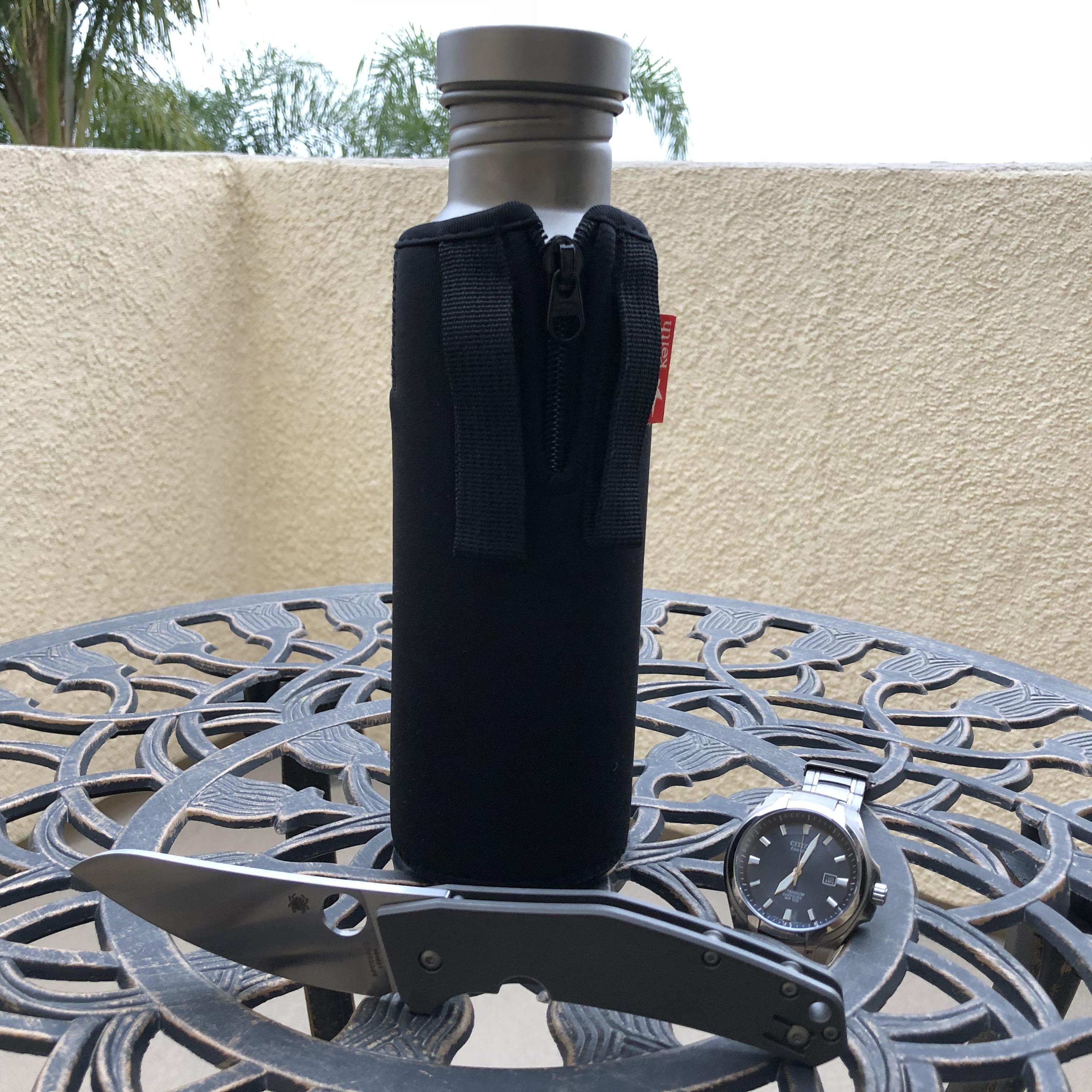 Going to the beach titanium style titanium bottle, watch, and blade