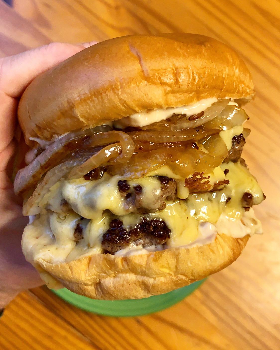 Double burger with gouda, bbq animal sauce, and caramelized onions r