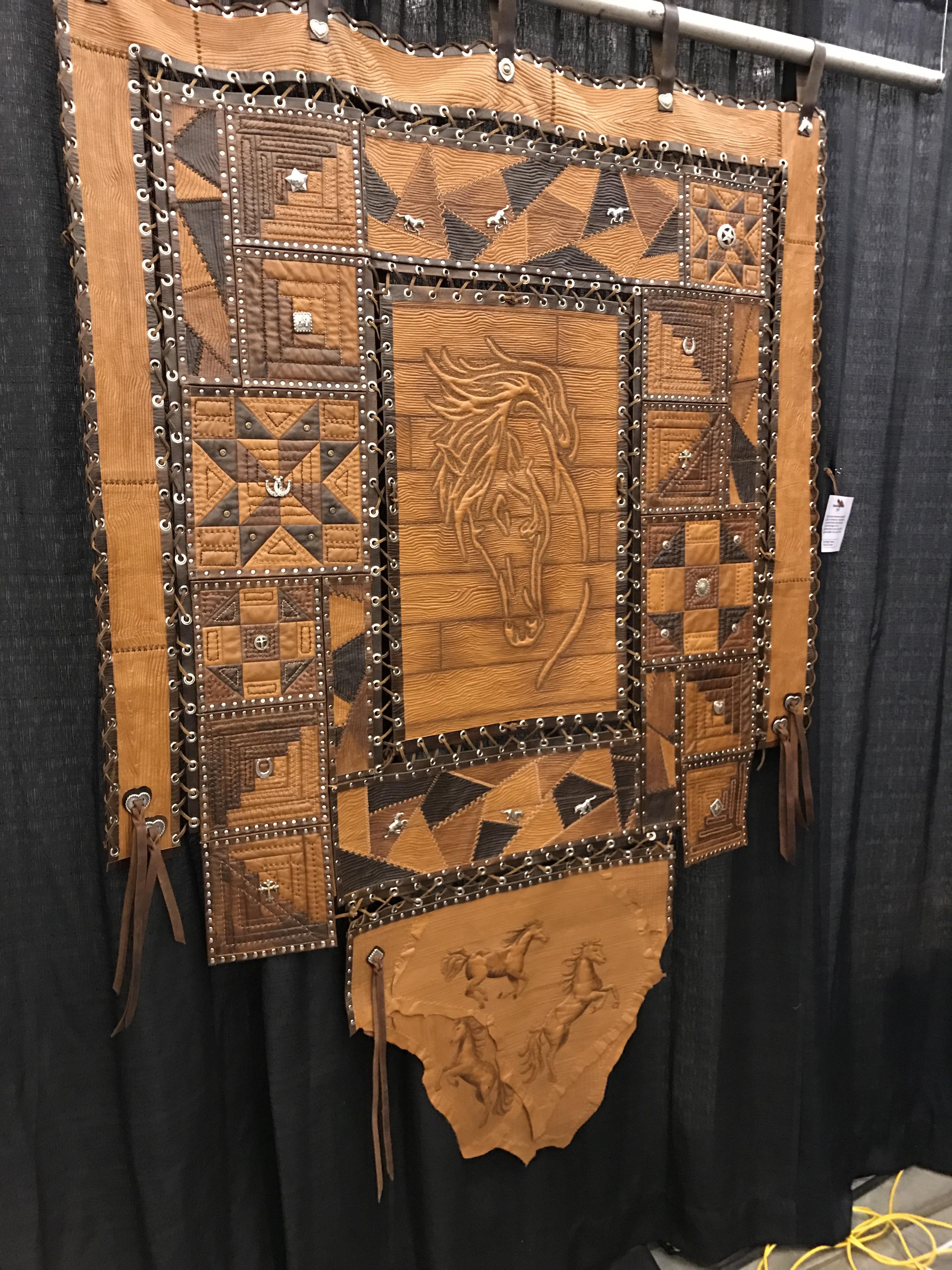 Quilting with leather. Went to a show today and saw this beautiful