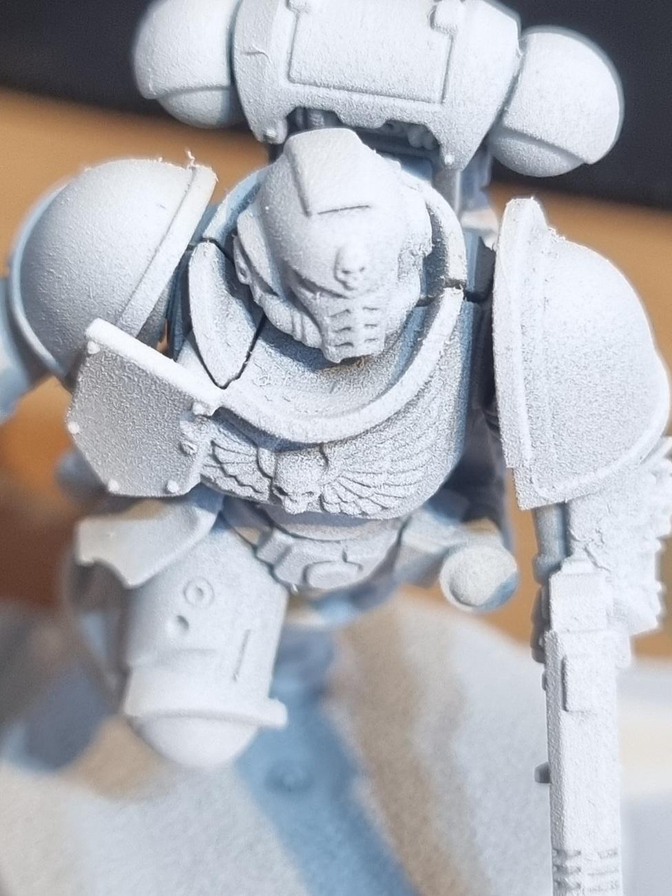 Got this grainy/speckly result with GW White Scar Spray Primer r