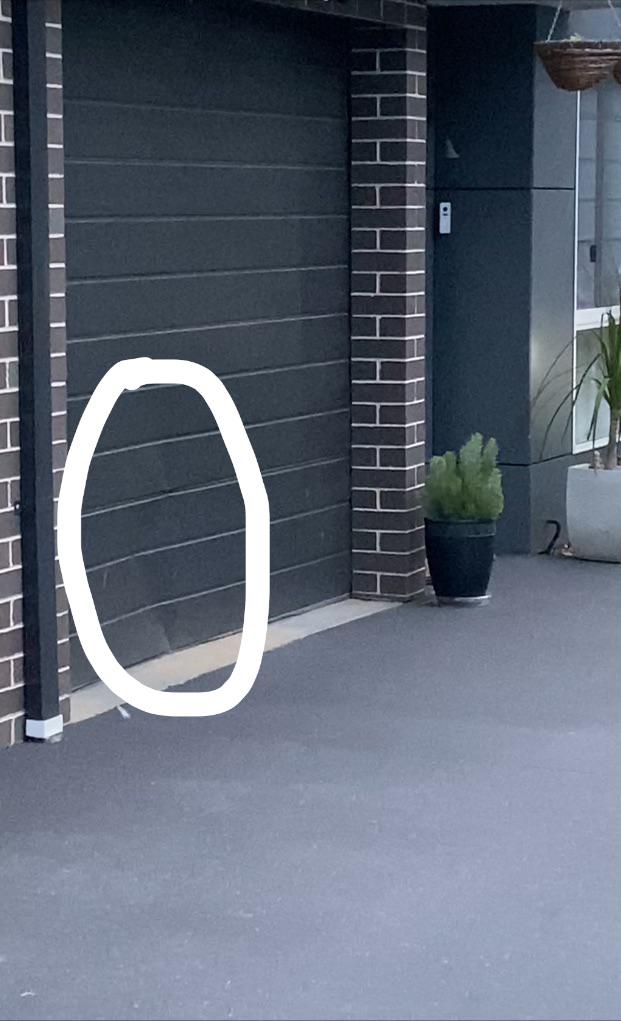 Does anyone know the average cost of fixing a garage door dent? r