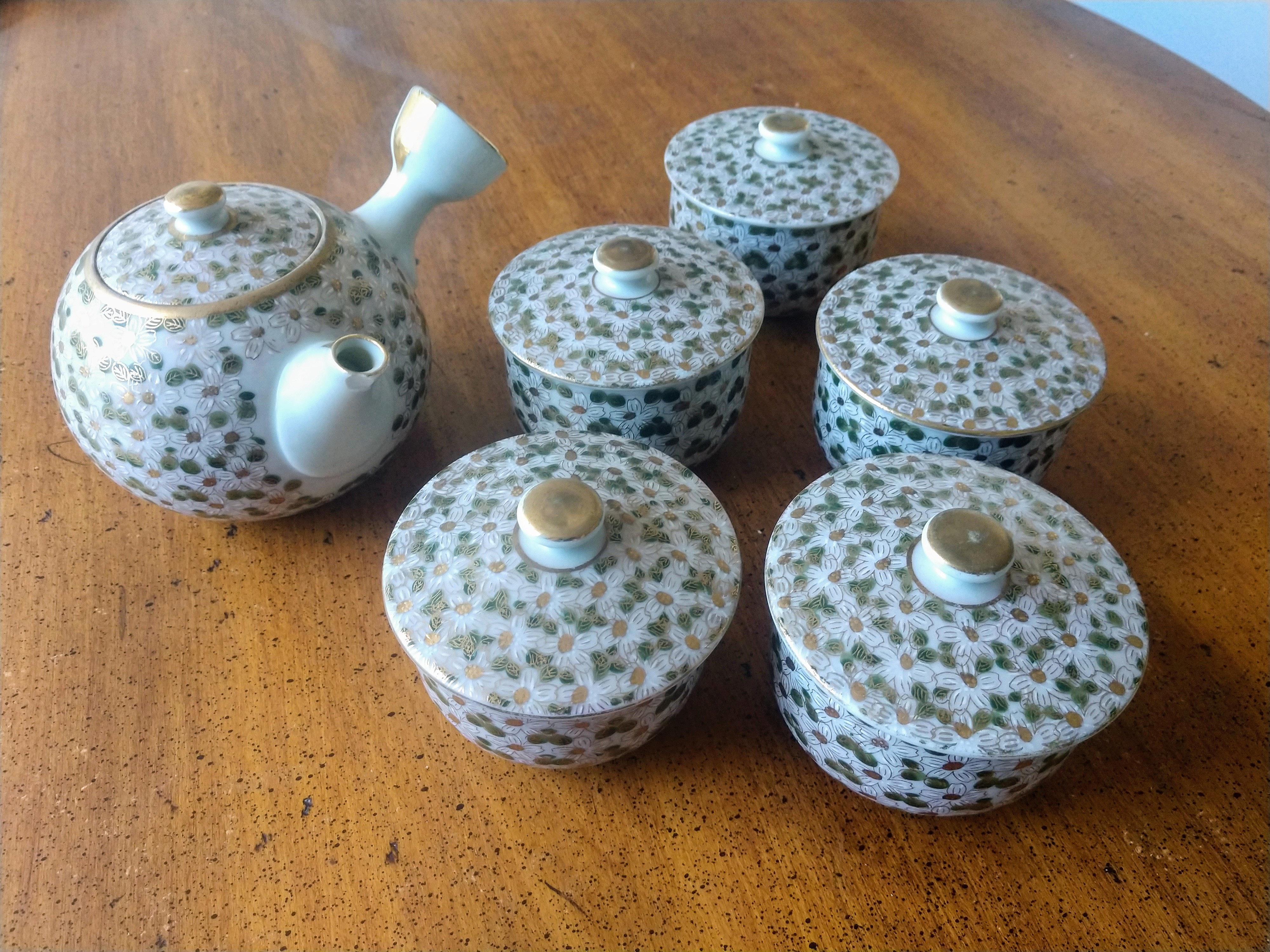 Cute Japanese tea set for 14! Curious if anyone knows anything about