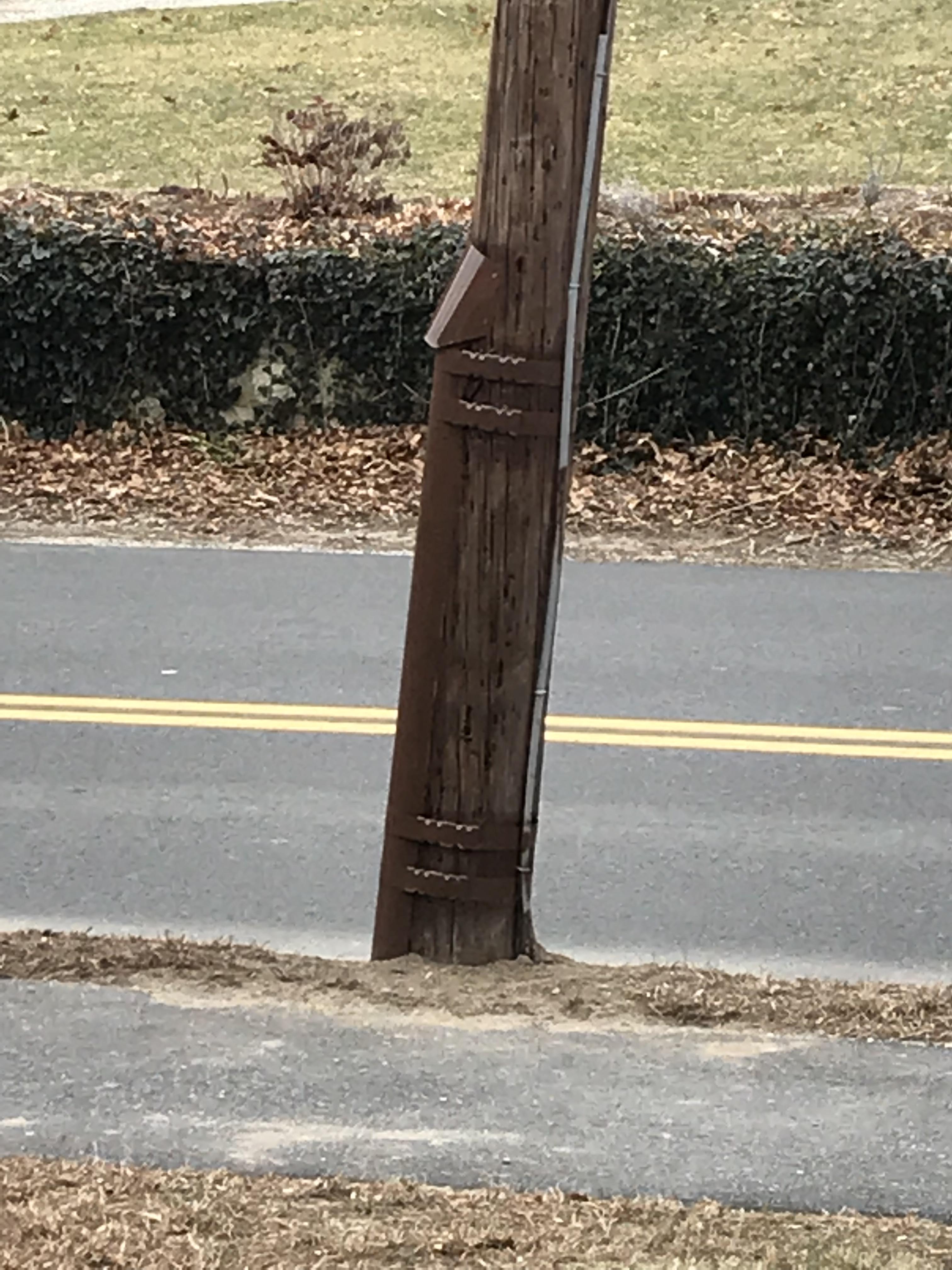 What is this metal bracelooking thing at bottom of telephone pole r