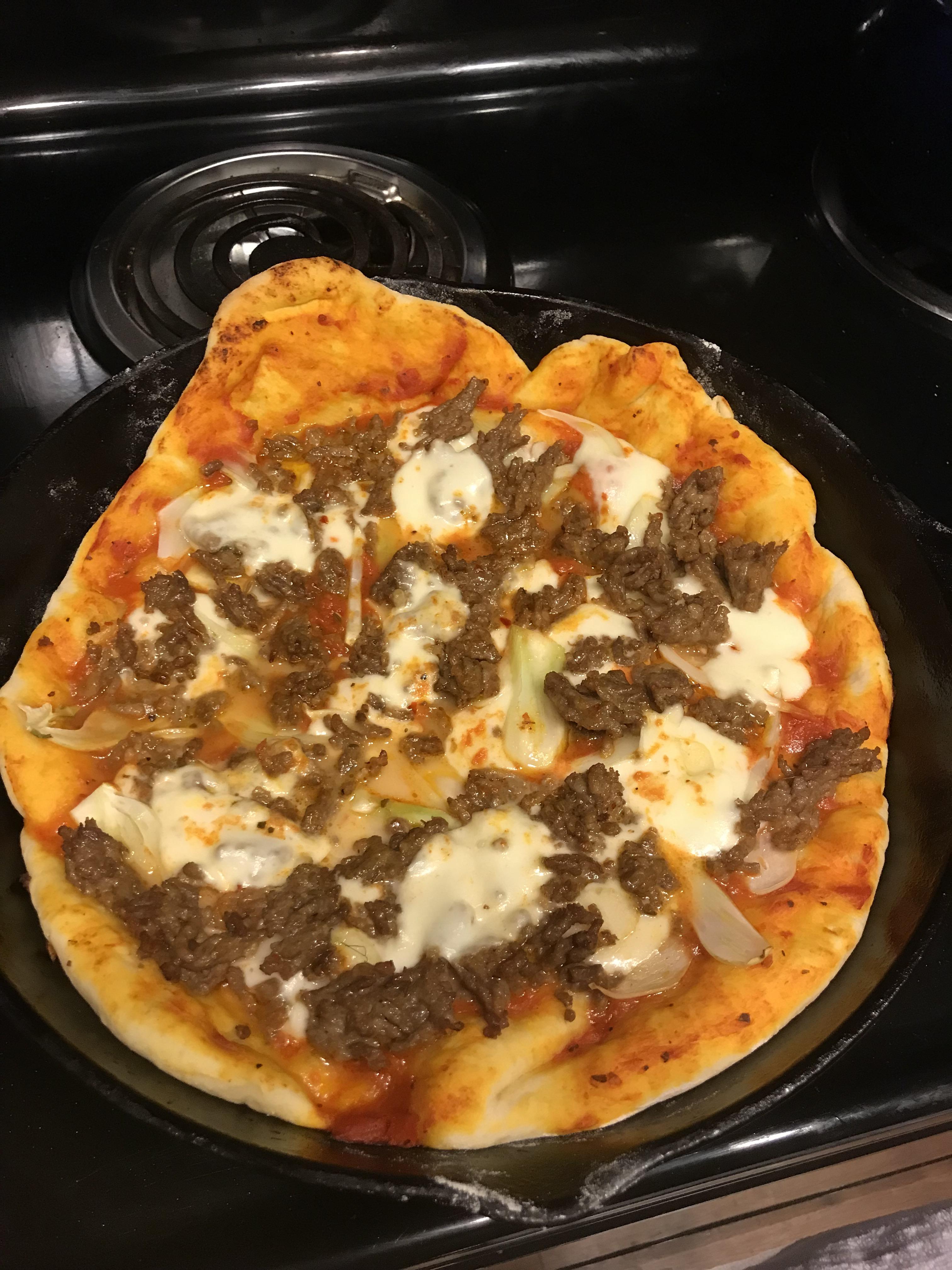Skillet pizza w/ fennel, sausage, & mozzarella in the 12” lodge r