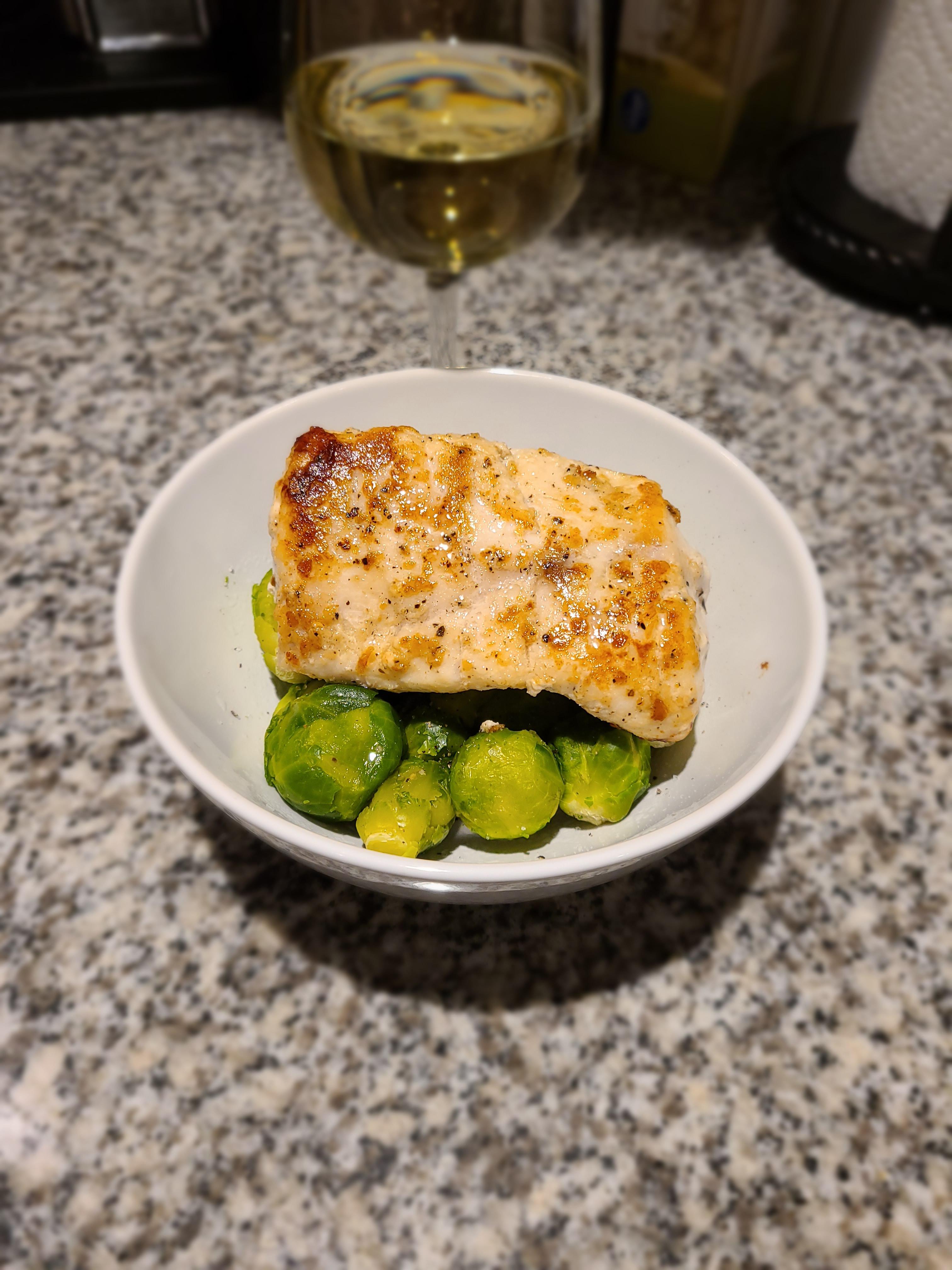 Pan cooked Grouper with LOTS of butter and garlic over steamed Brussels