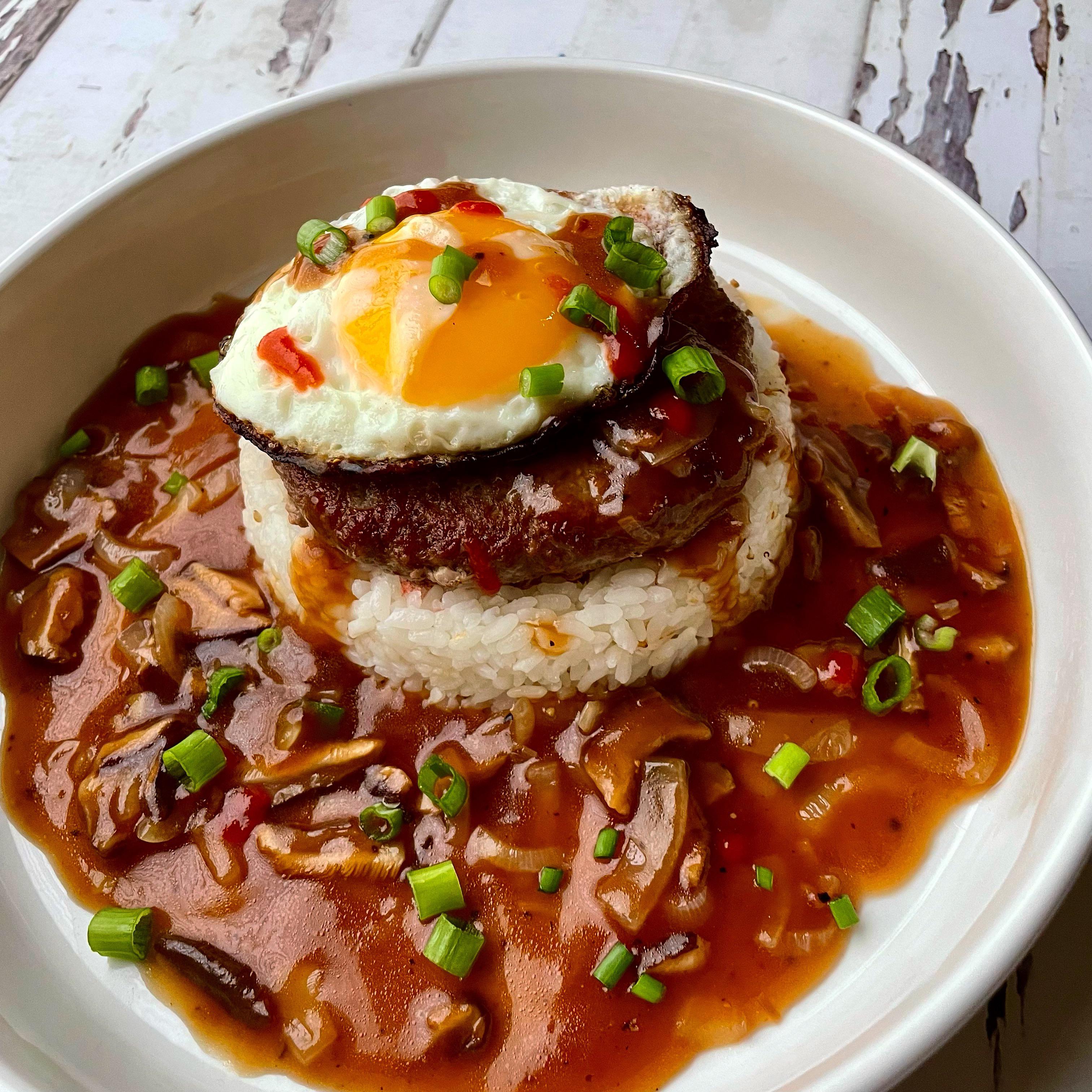 Loco Moco White Rice. Hamburger Patty. Frizzled Egg. Brown Gravy with