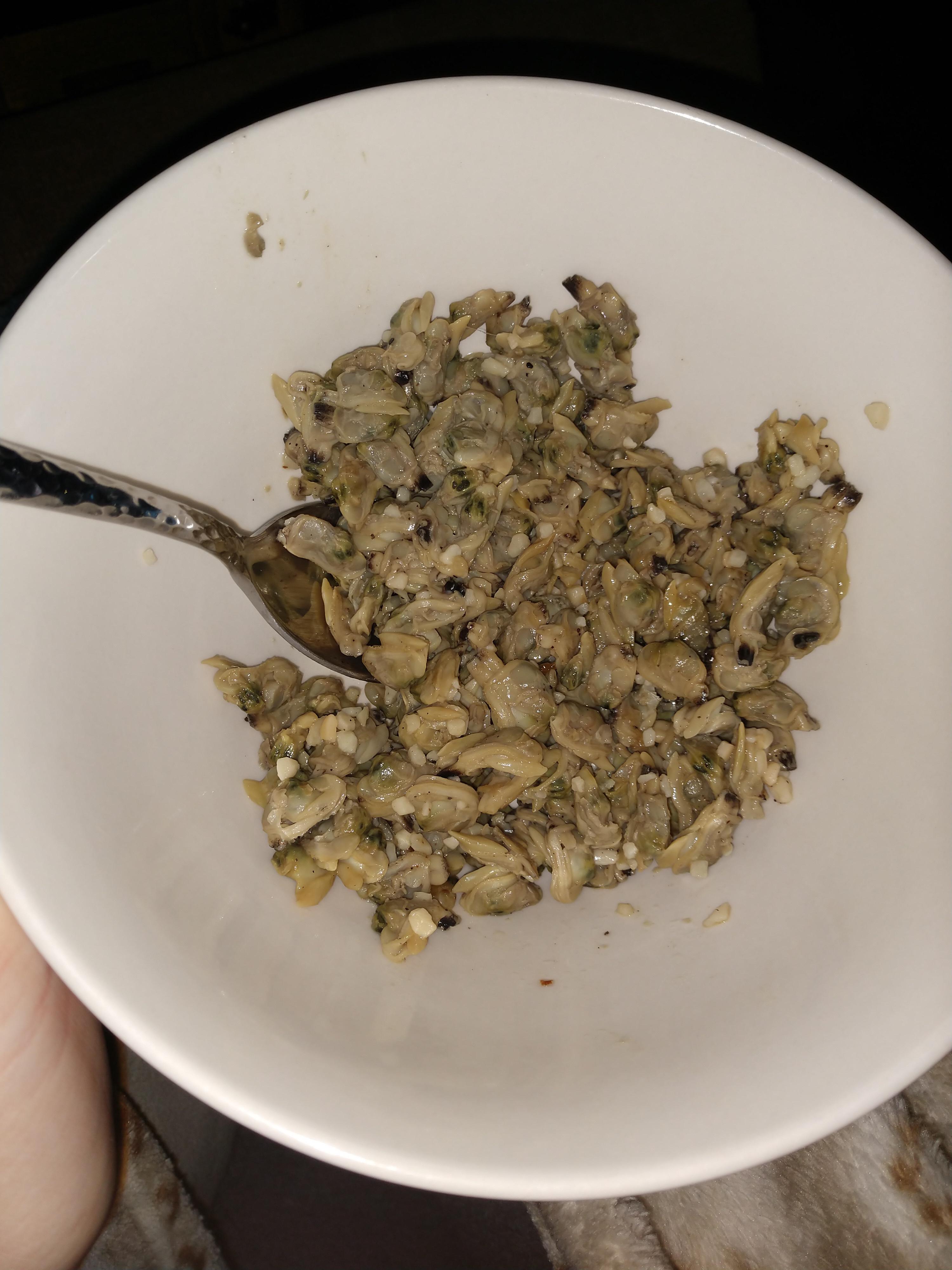 Canned baby clams with garlic, cracked pepper, and butter. r