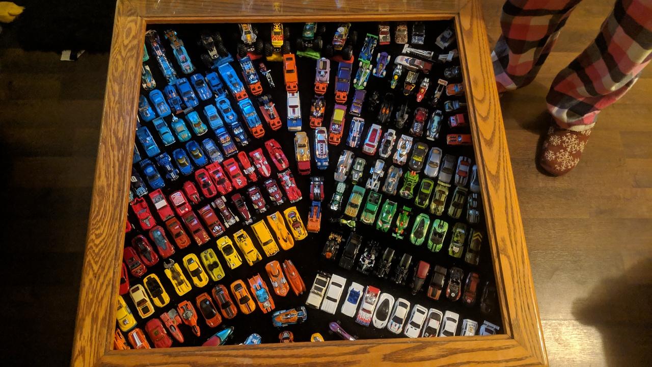 My coffee table with a 188 cars in it. r/HotWheels