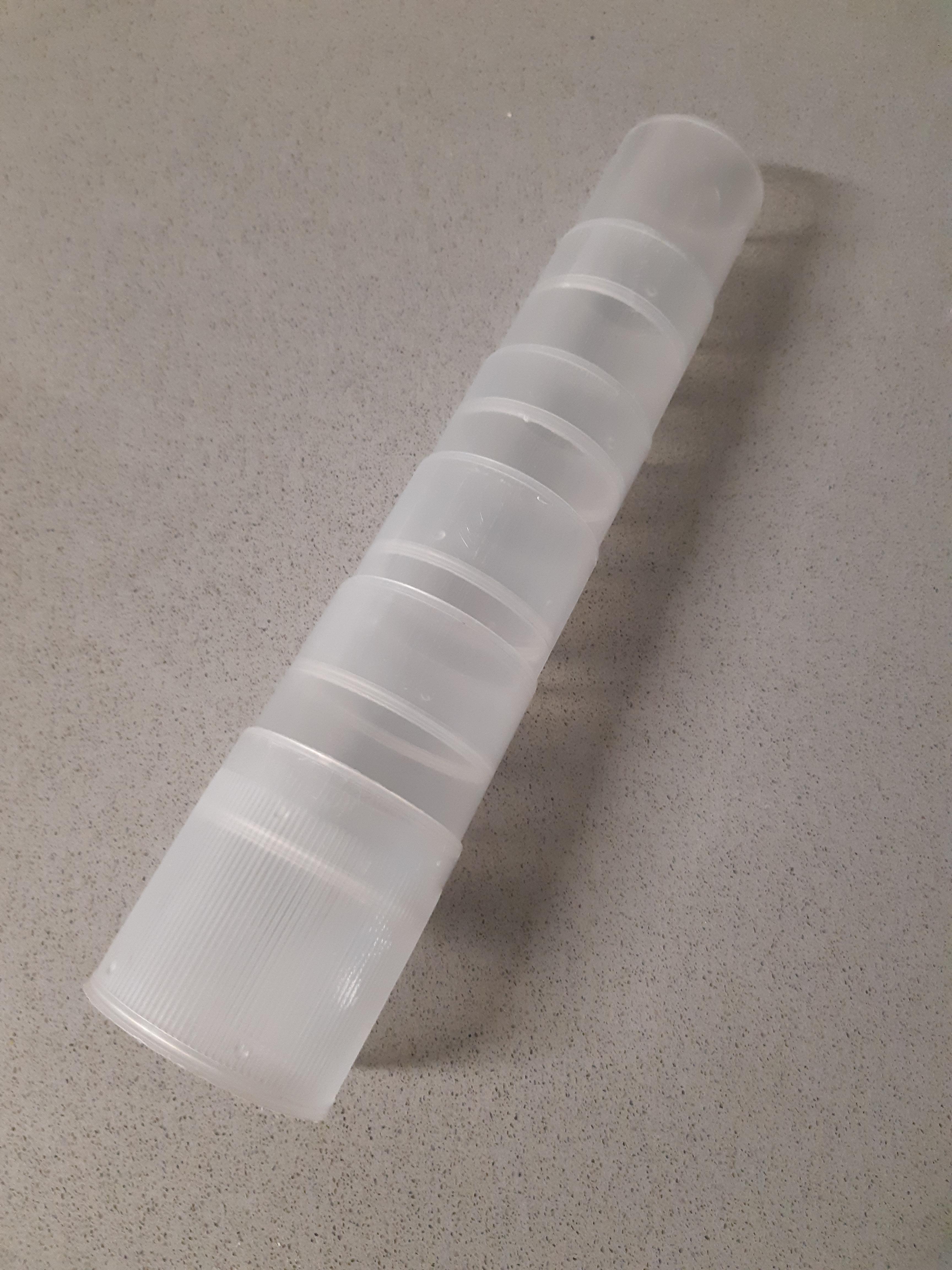 A plastic tube about 20cm in length open at both ends. The pieces slide