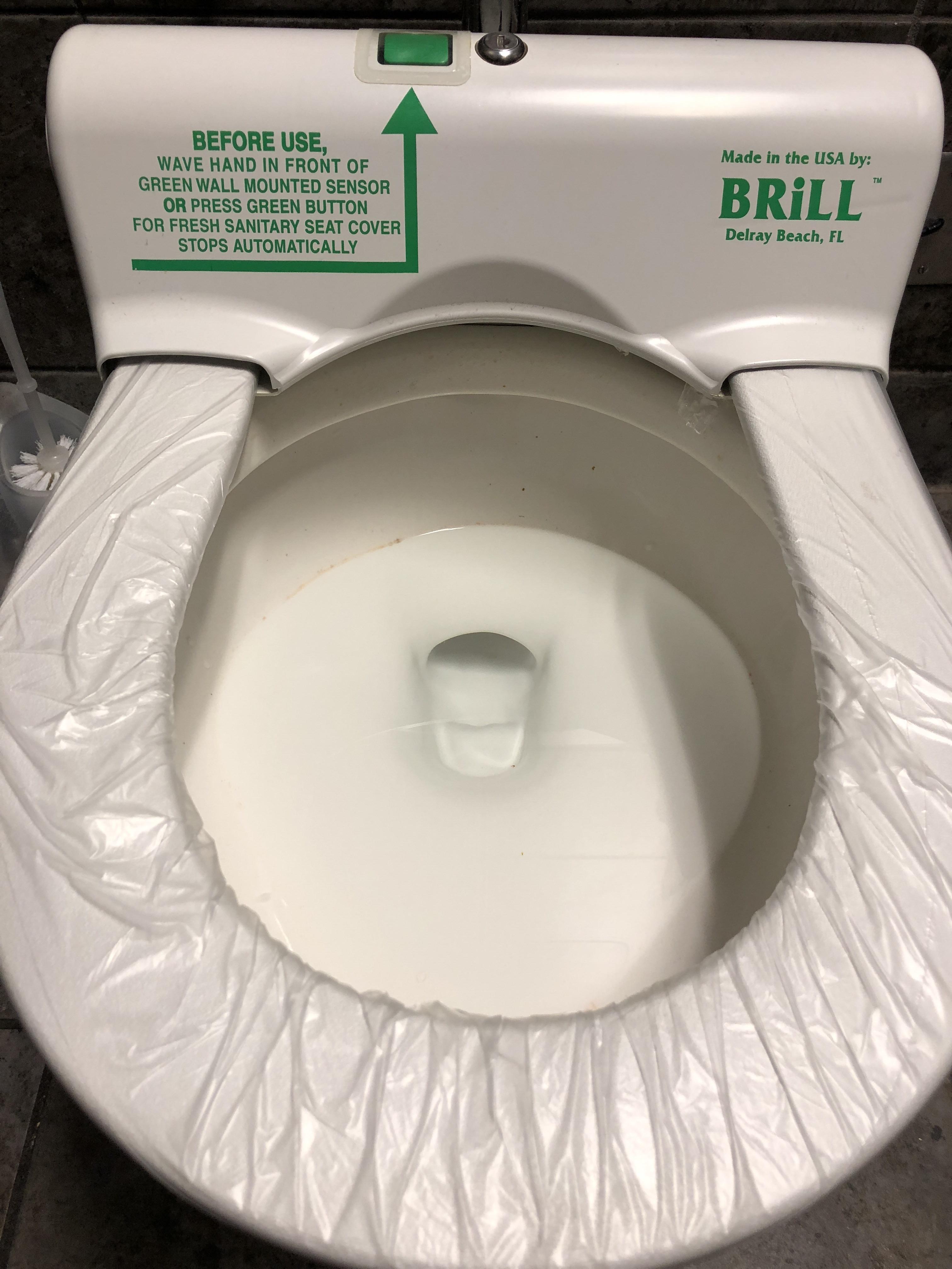 This toilet has a fresh sanitary seat cover for each use