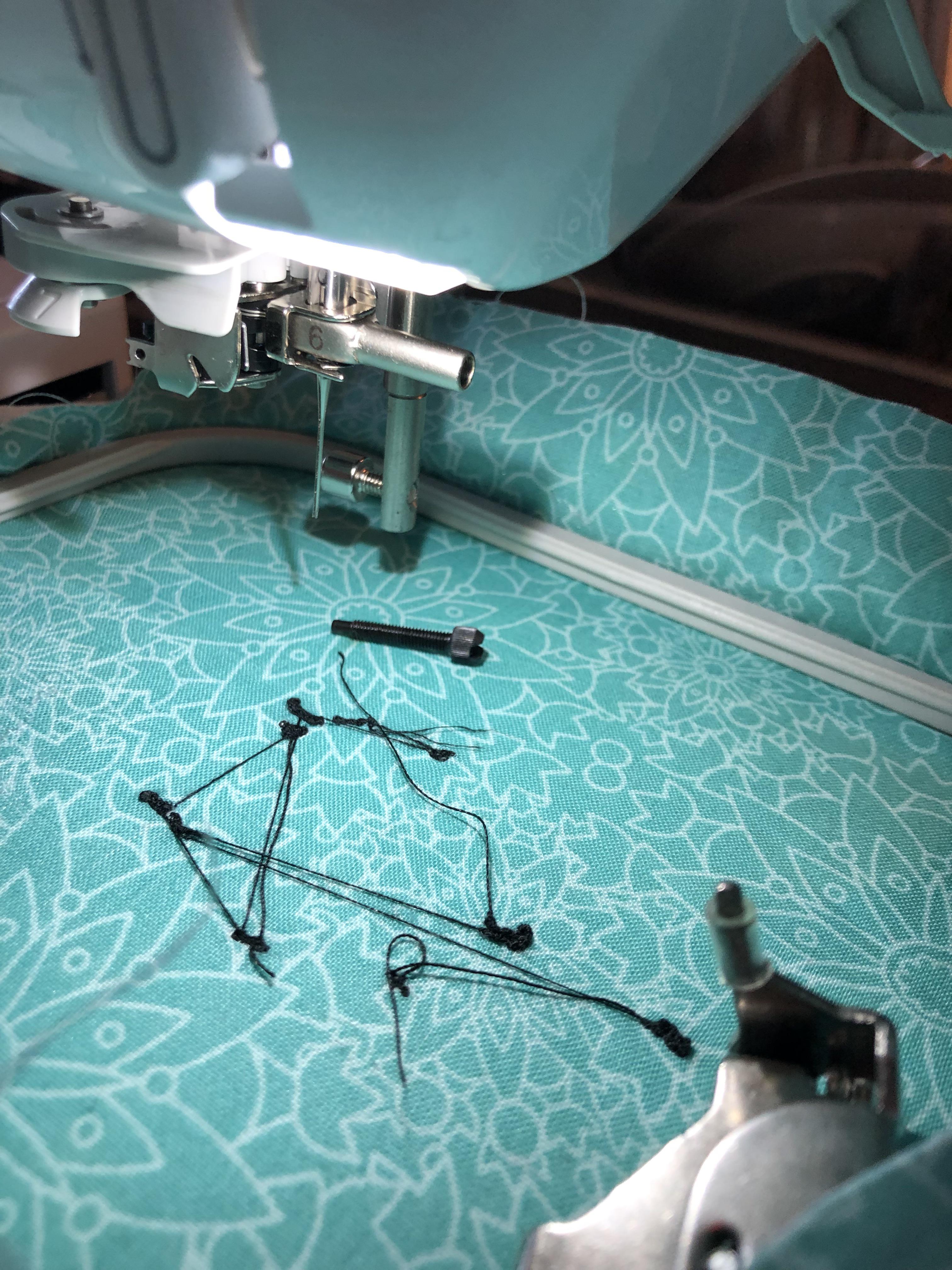 Needle stuck in machine. The needle hold is entirely unscrewed but the