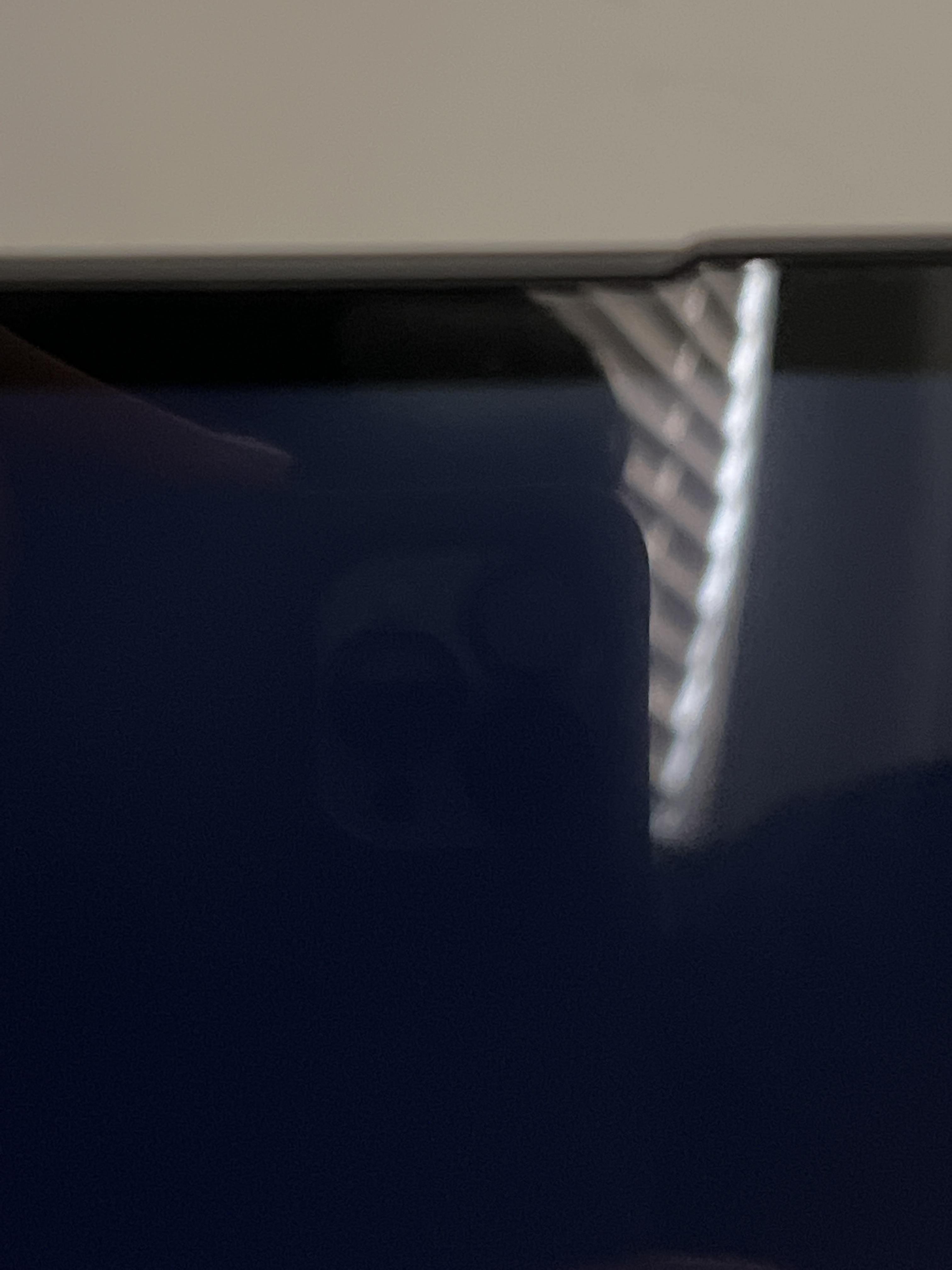 I have a green spot on the edge of my laptop when the screen goes black. Should I return the