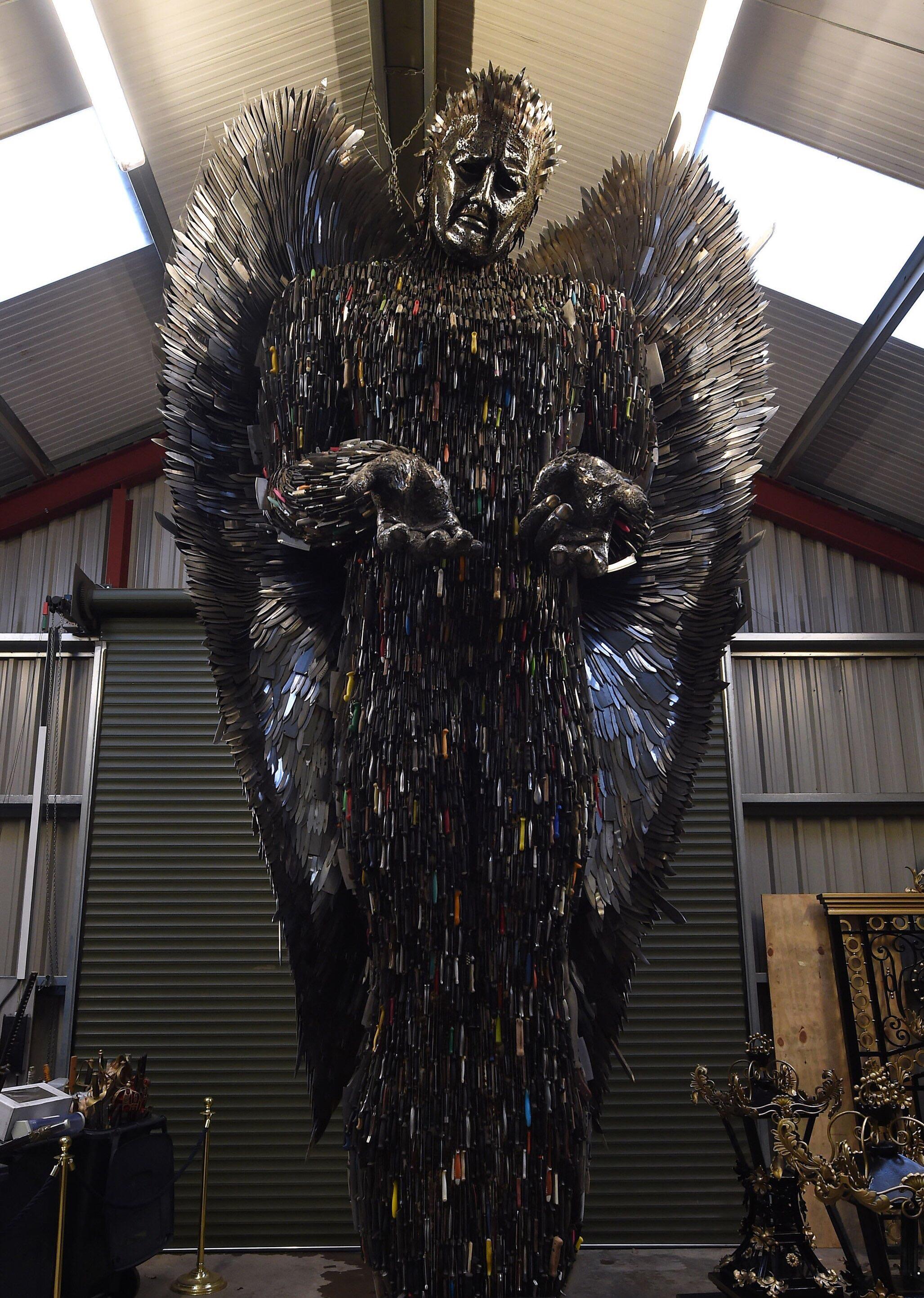 27 foot statue made of over 100,000 knives confiscated by the police