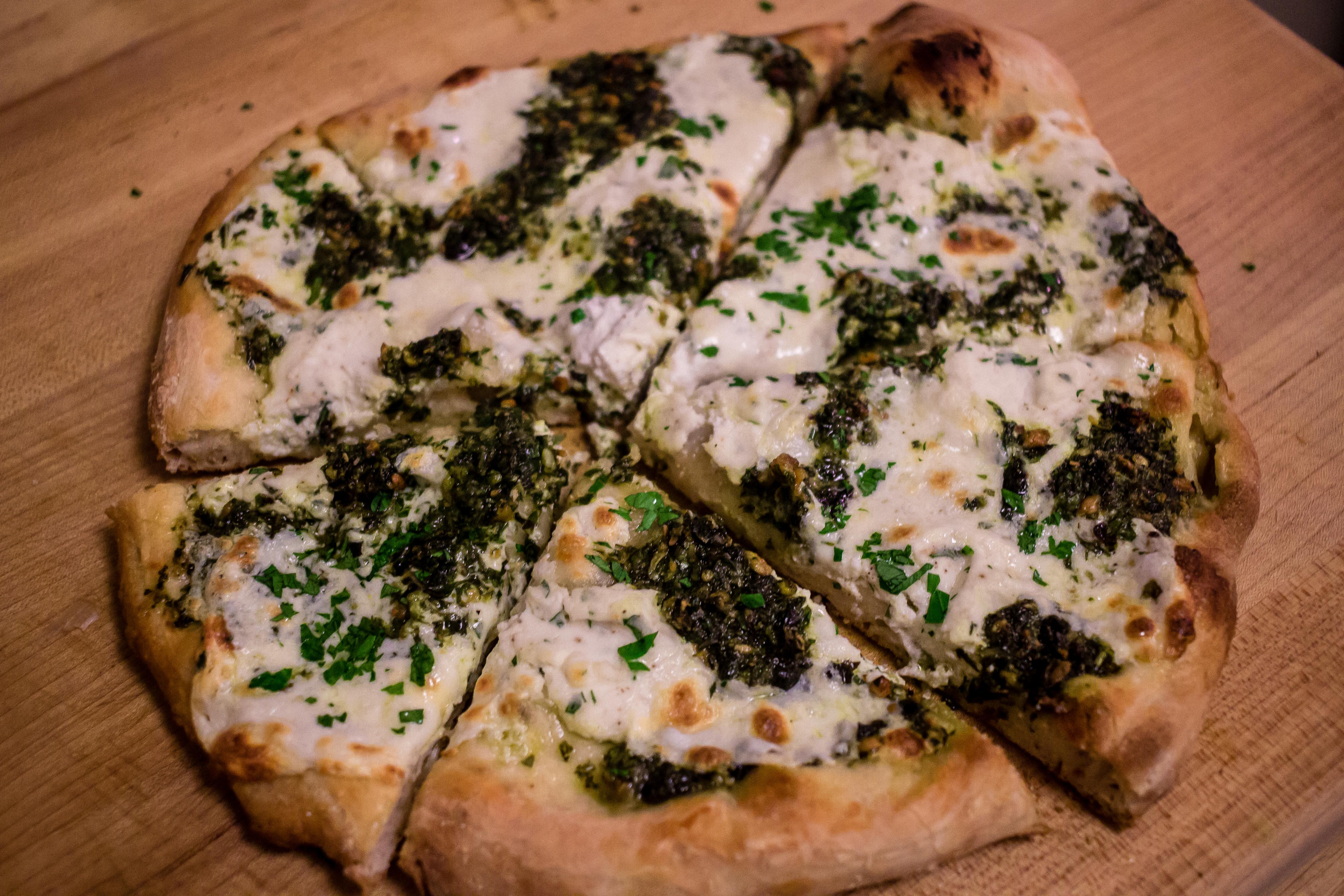 White pizza with pesto! (Roasted garlic, parmesan, ricotta, mozzarella