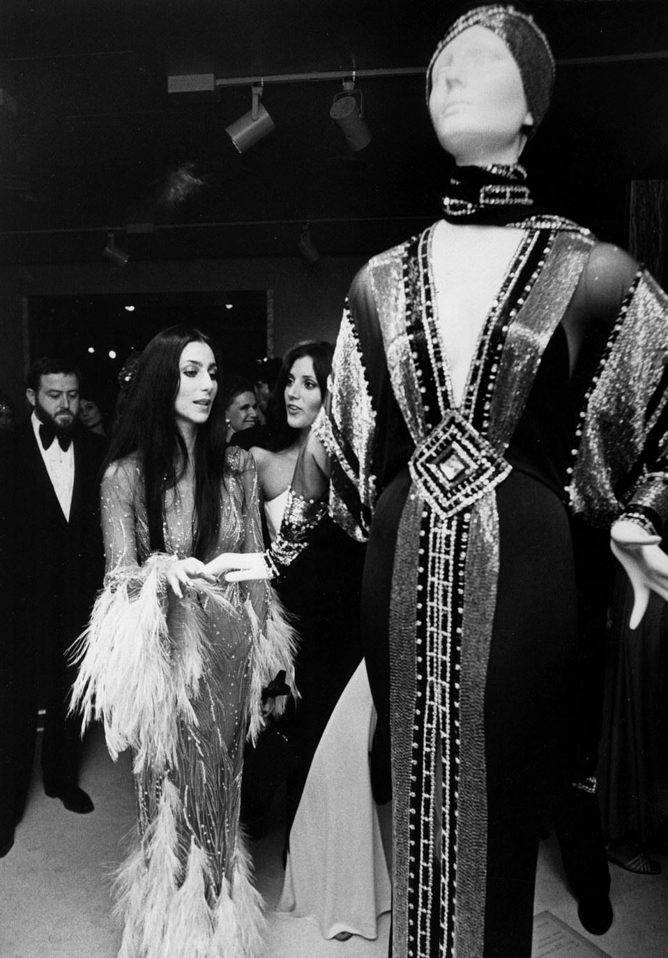 Cher alongside her best friend Paulette Betts looking at a costume