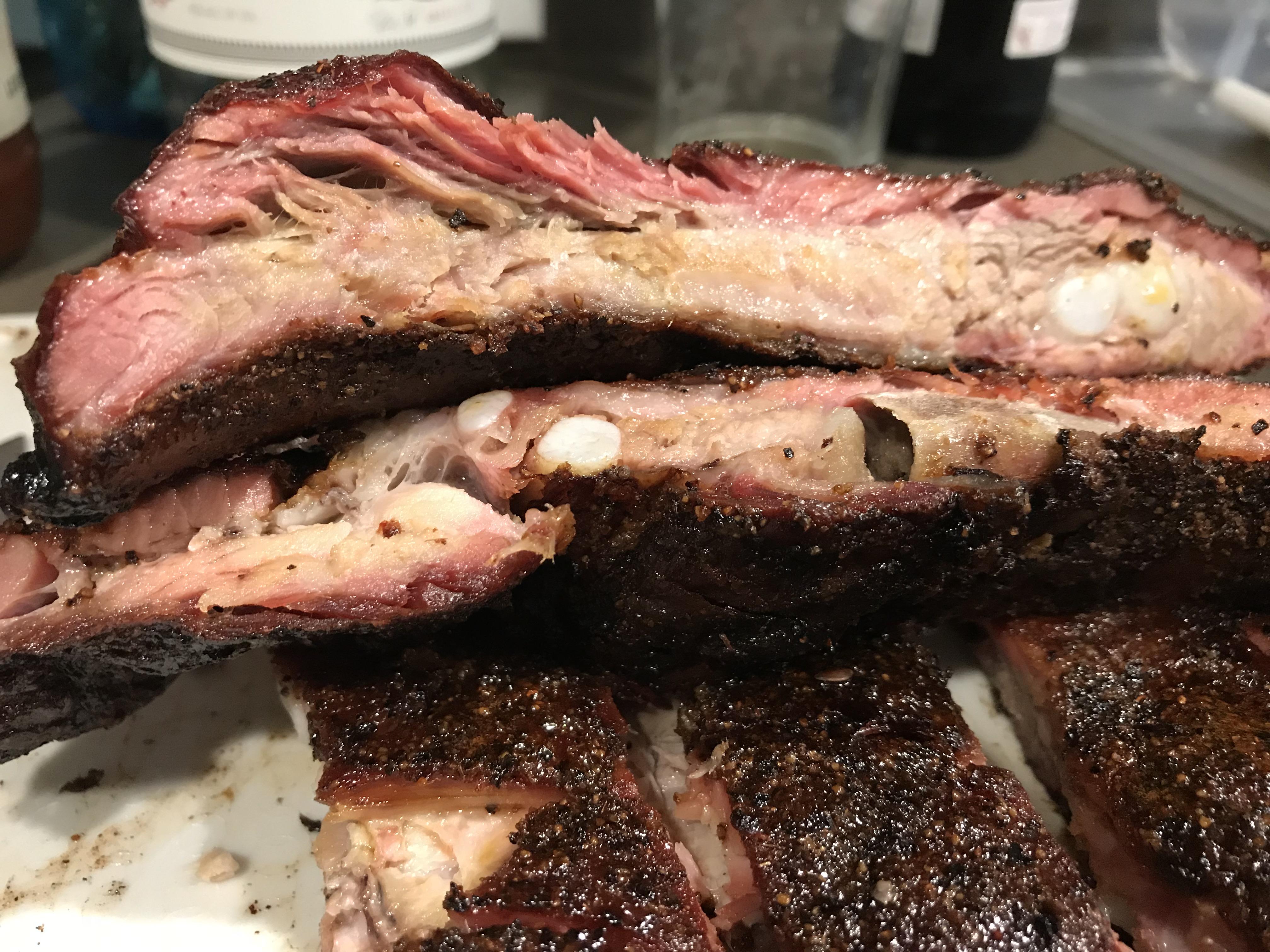 Spare ribs at 250° for 9 hours over cherry wood, no wrap. Over the top