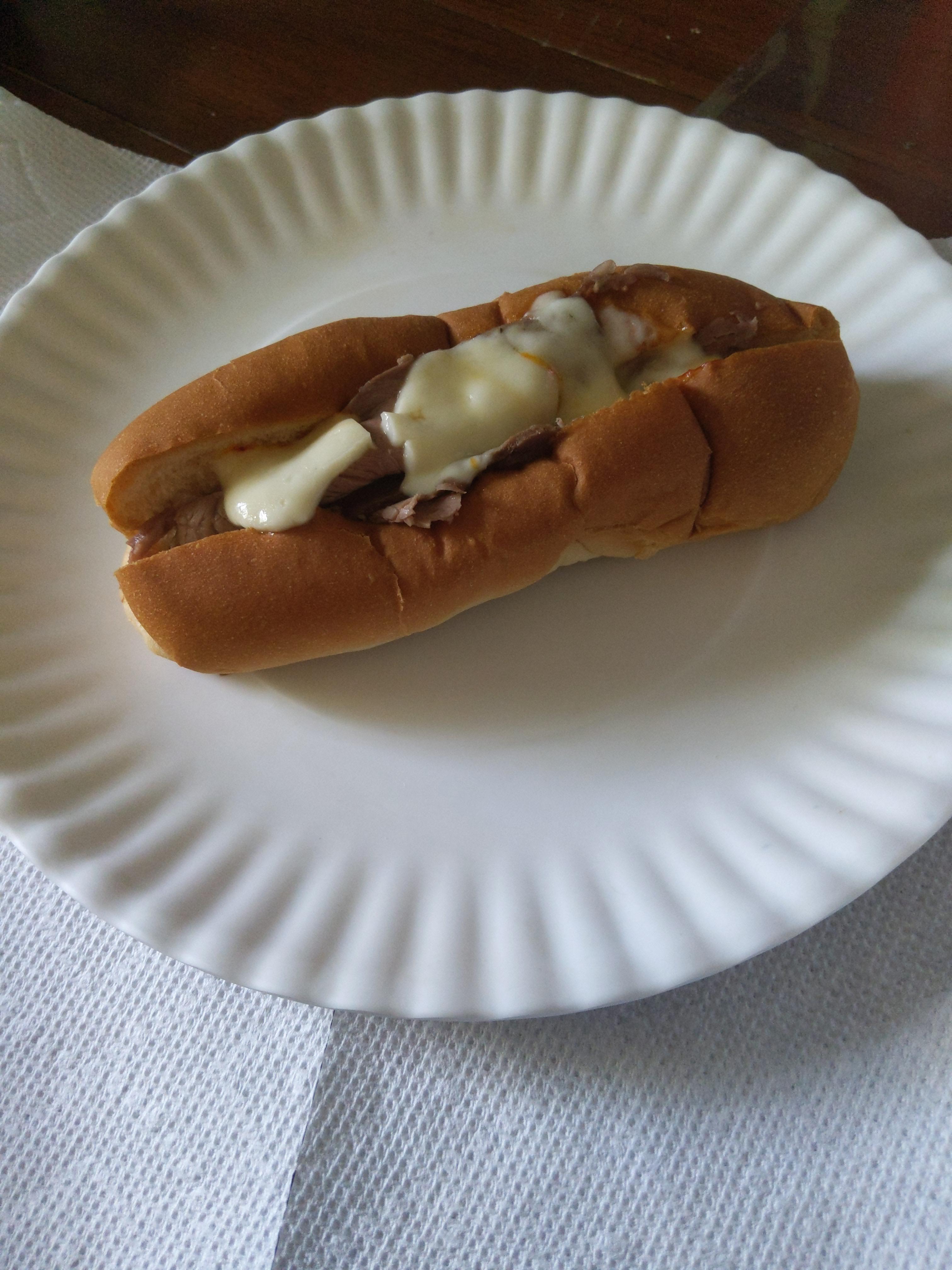 Roast beef and Muenster cheese in a hotdog bun, microwaved r