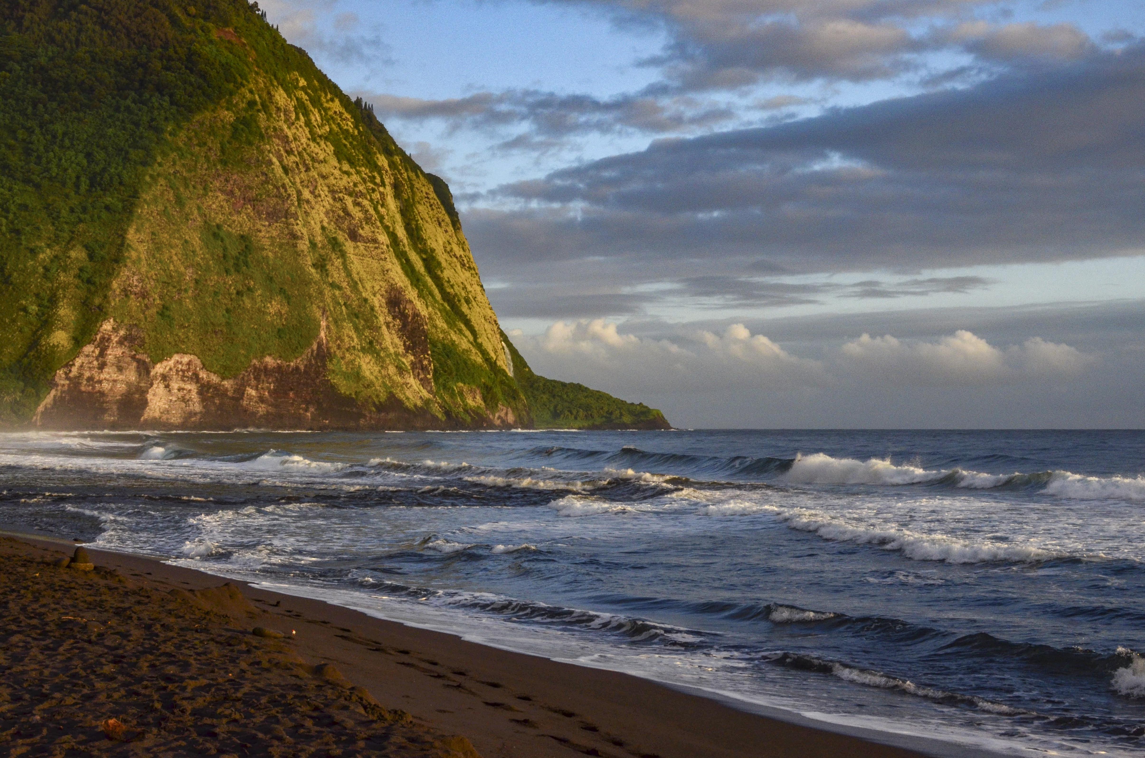The cliffs of Waipio Valley glow in the early morning light. Big Island