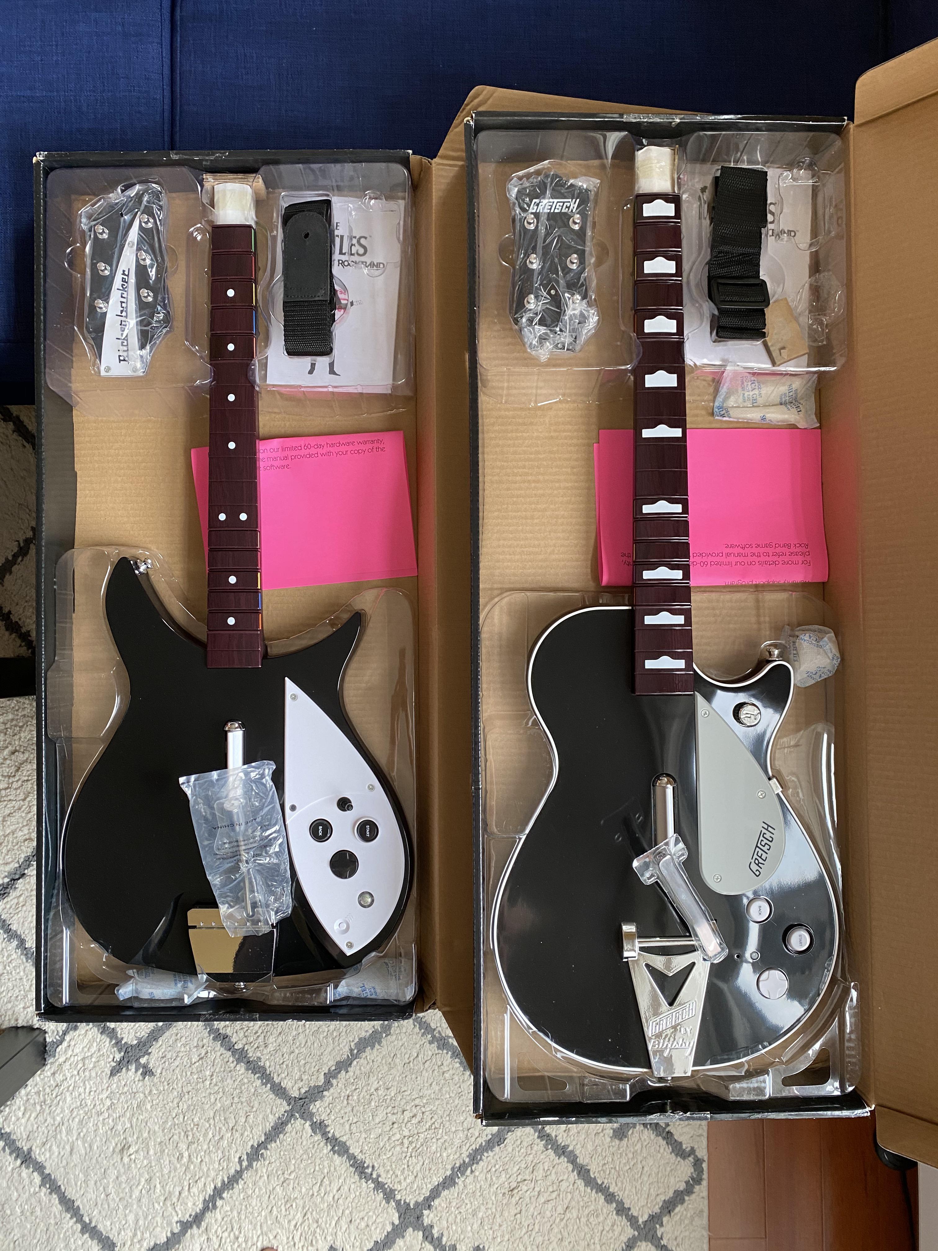 After 11 years, finally got these Beatles Rock Band guitars new in box