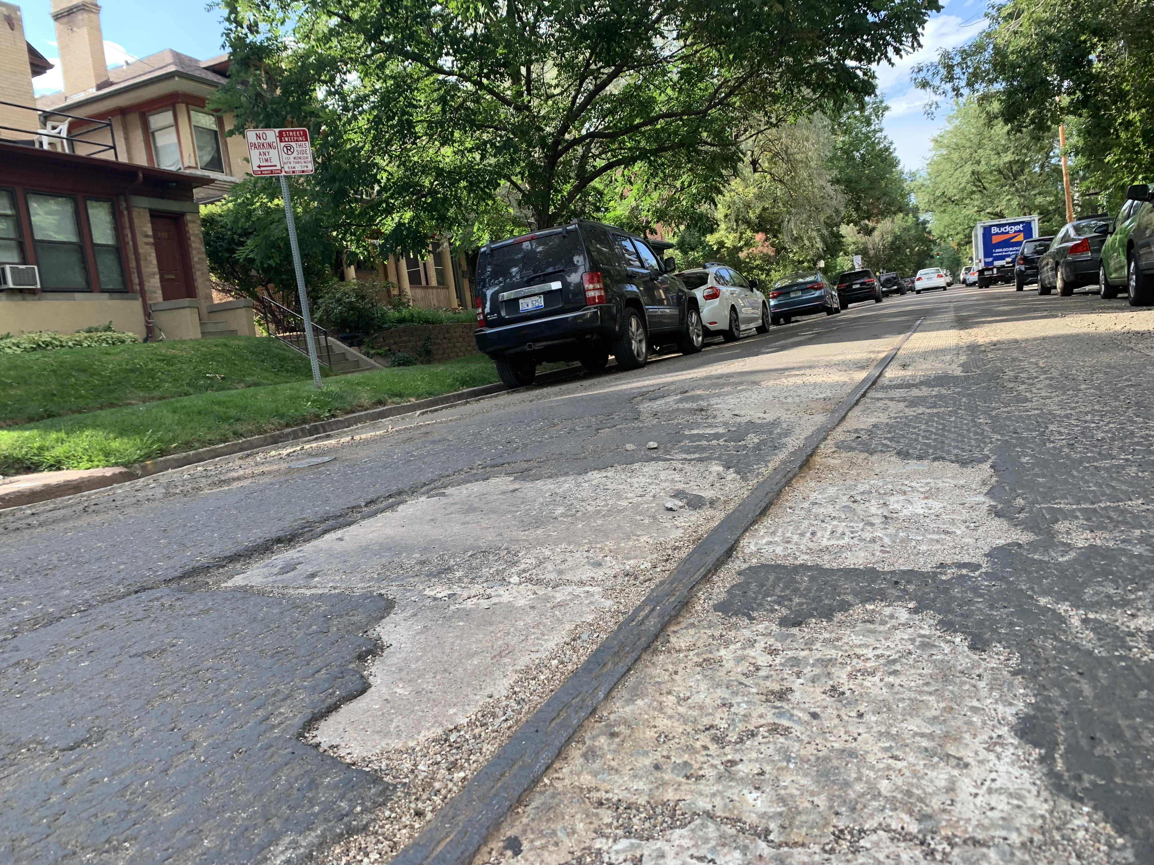 Road milling reveals 100 year old railcar tracks. r/mildlyinteresting