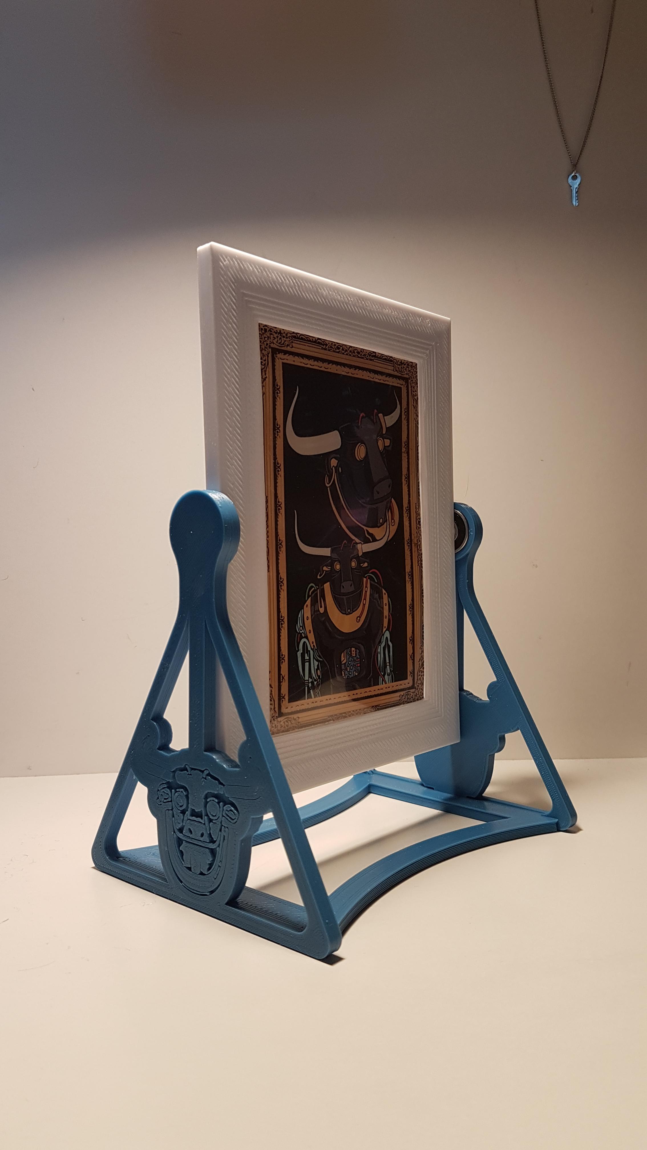 I designed and 3D printed this frame that spins for my postcard so I
