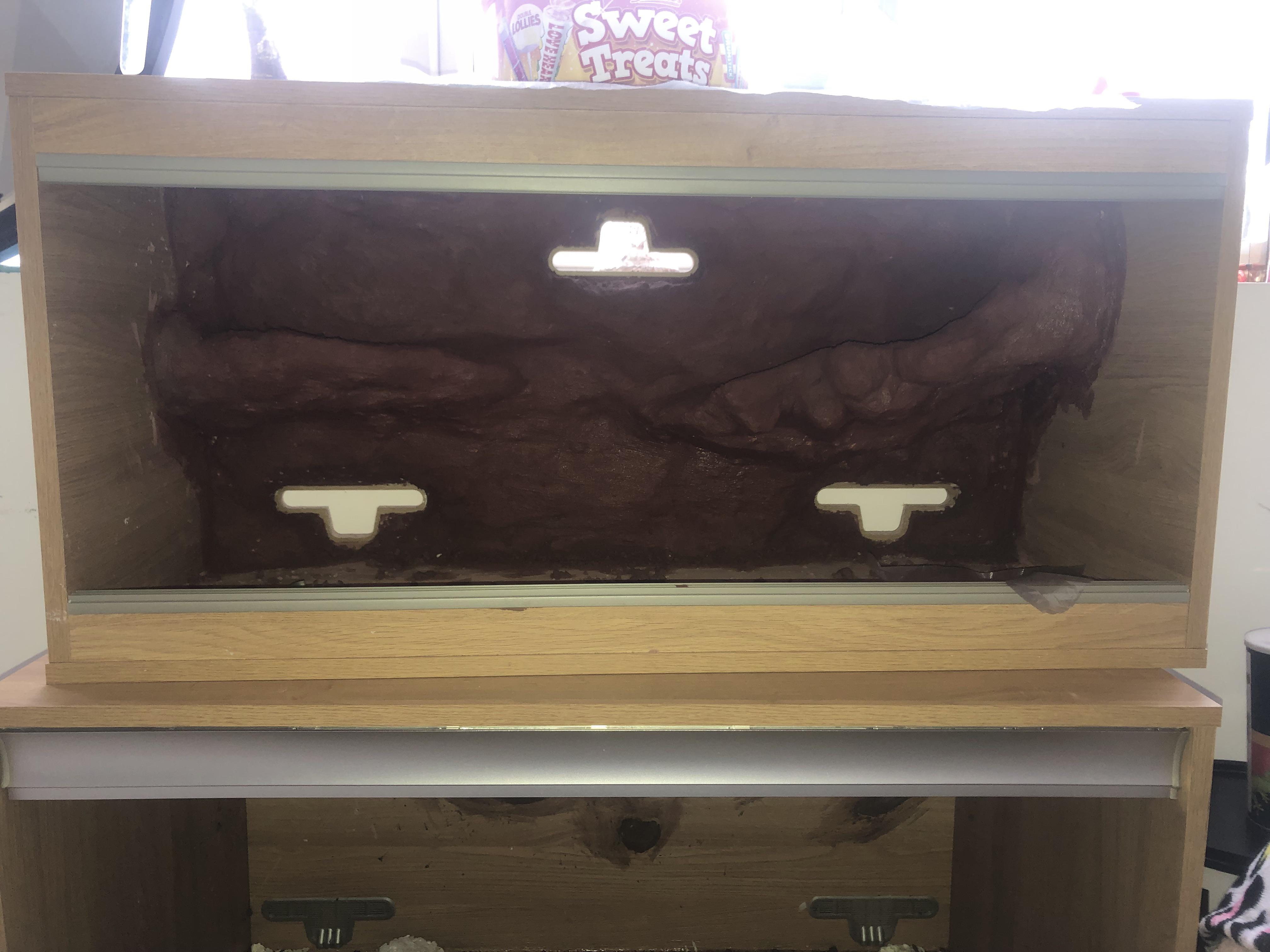 Anyone know a safe varnish/sealant for a concrete 3d background? (To