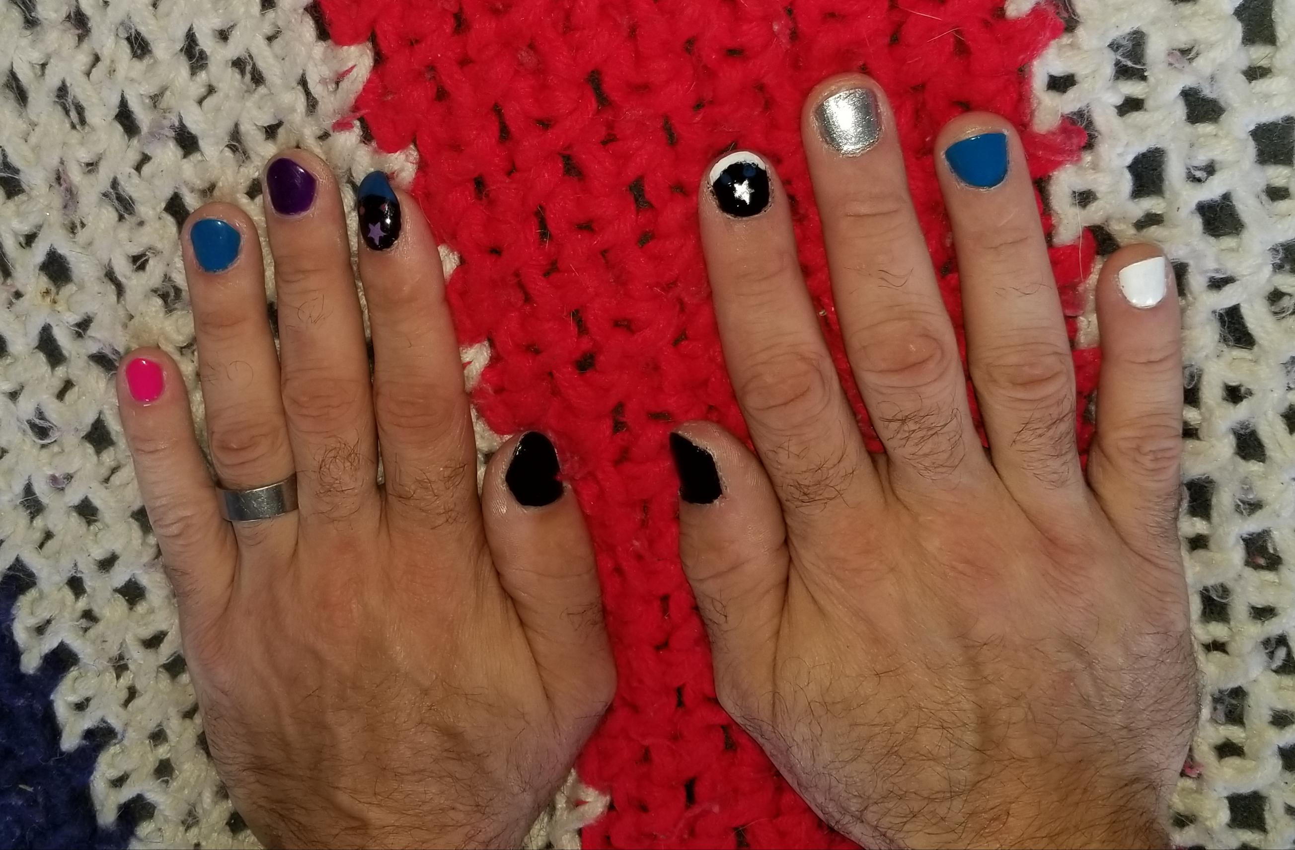 Bored home so I let my daughter paint my nails on my right hand. I