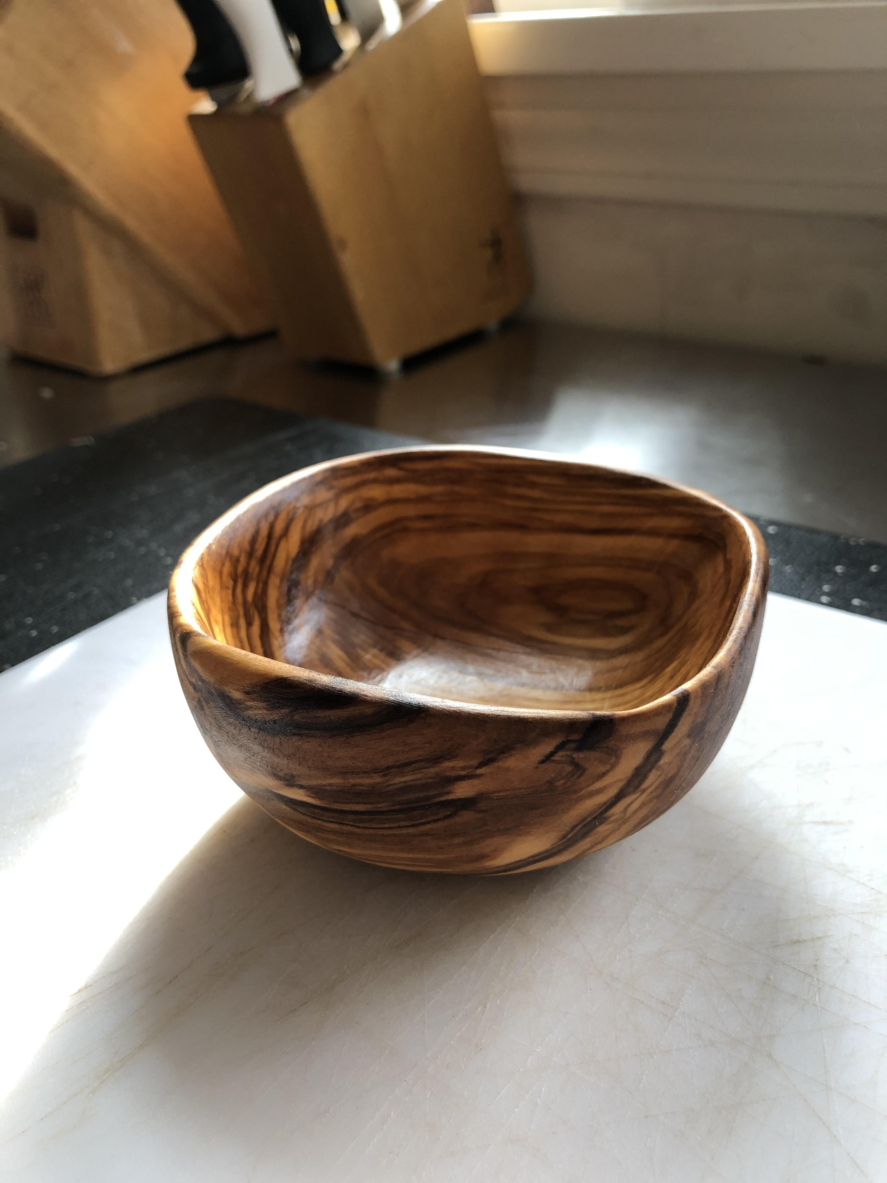 Small olive wood bowl I carved with a hook knife and sanded smooth