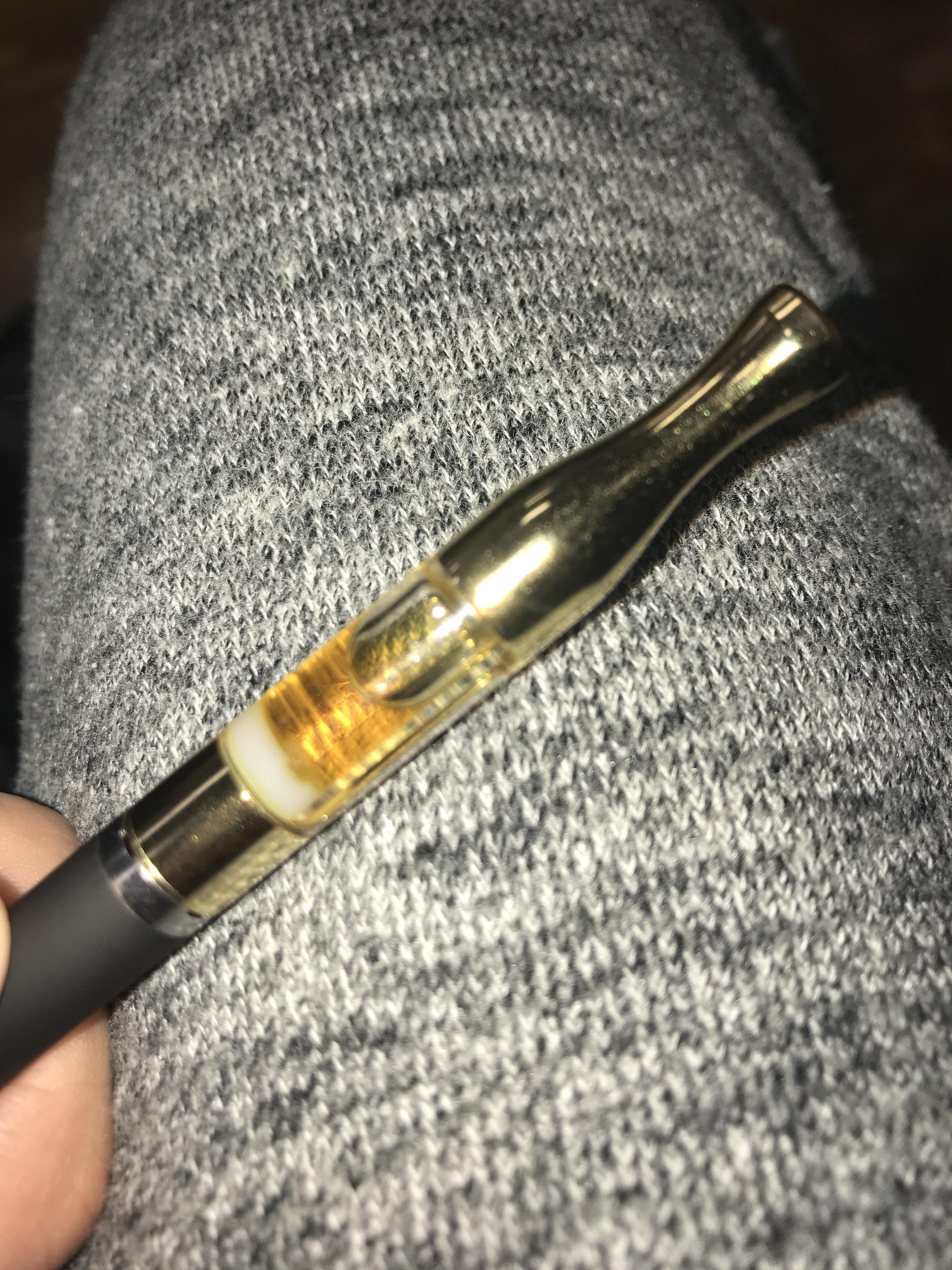 The white stuff at the bottom is covering the wick so it’s not