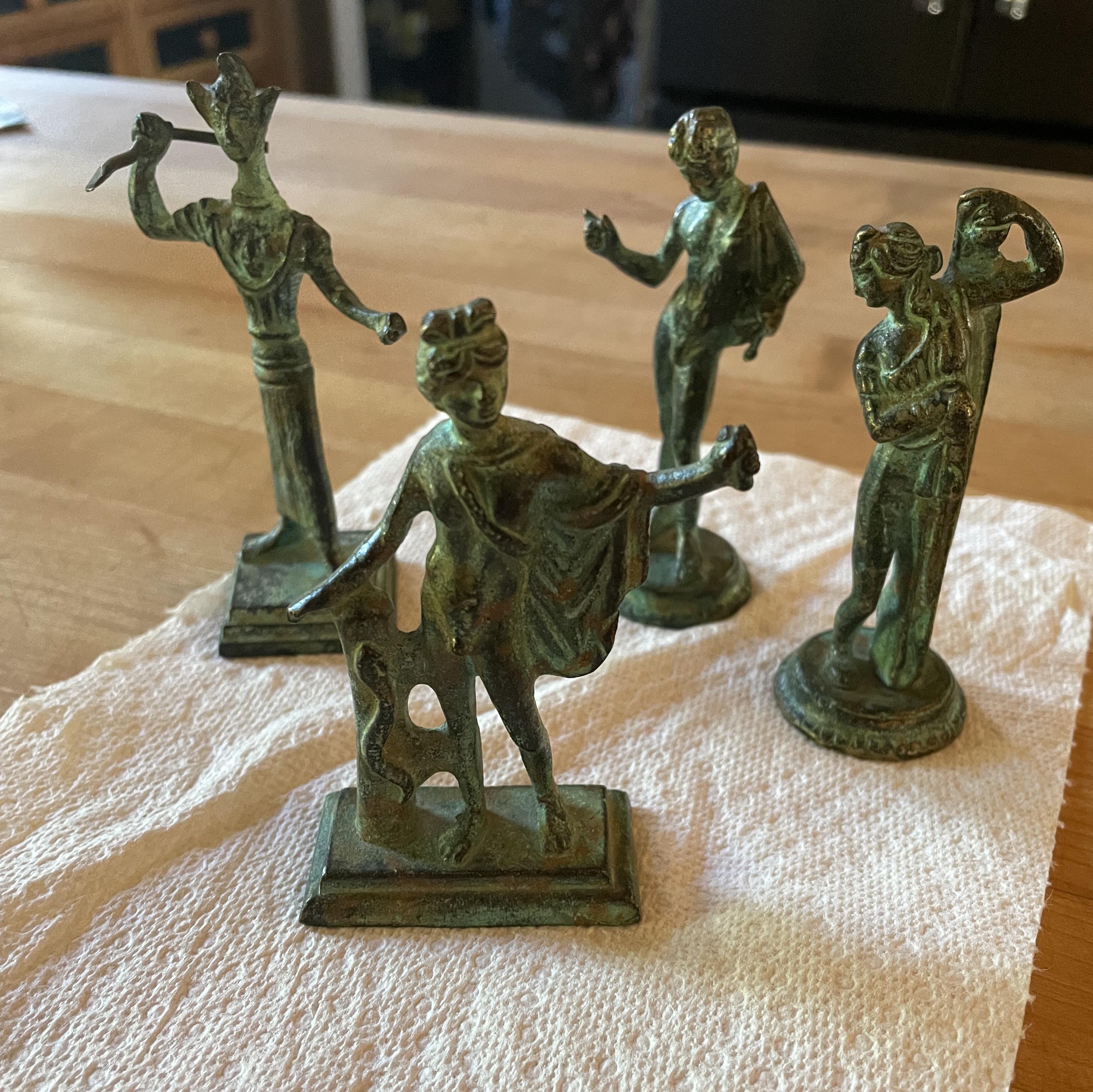 I have some old small metal statues here, was wondering if someone is