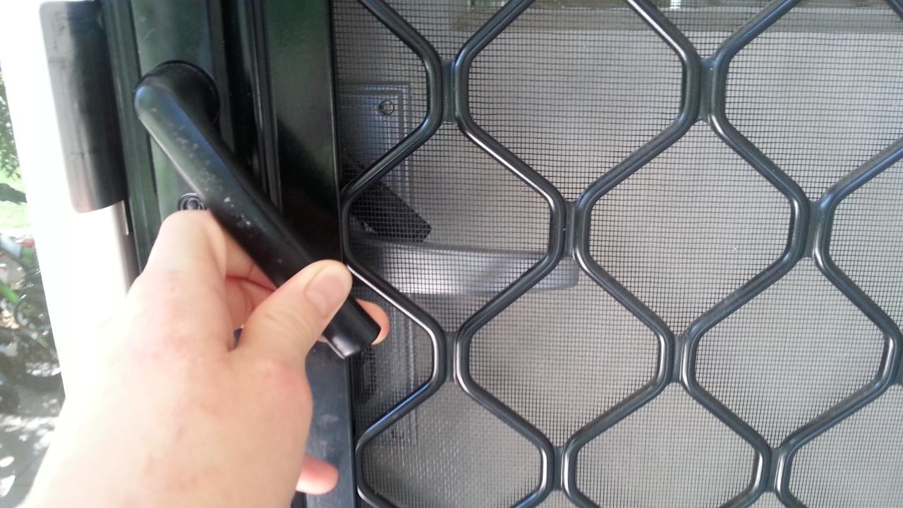 The screen door handle gets stuck behind the main door handle. r