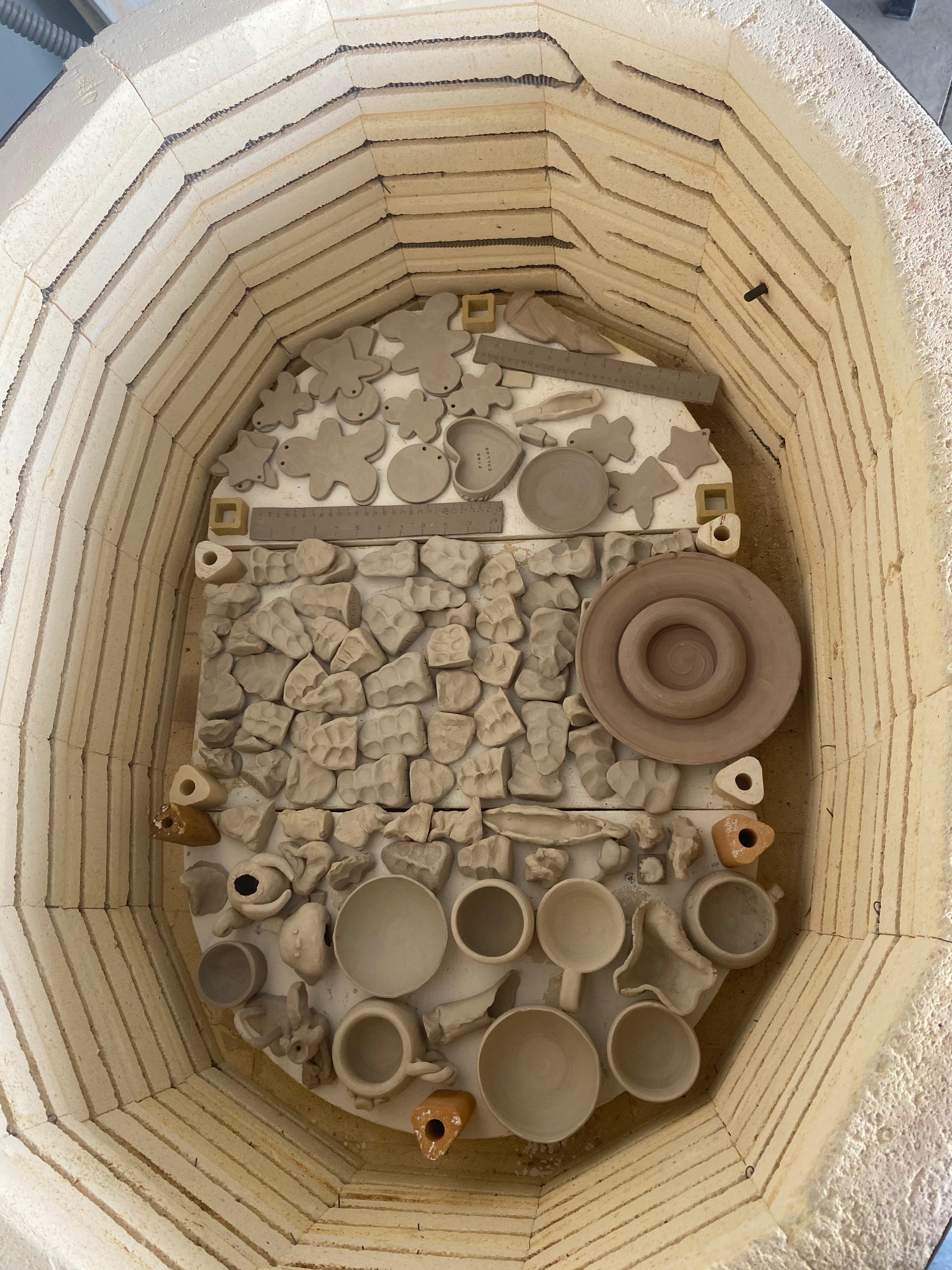 Greenware graveyard of test tiles ready for cremation (bisque) r/Ceramics