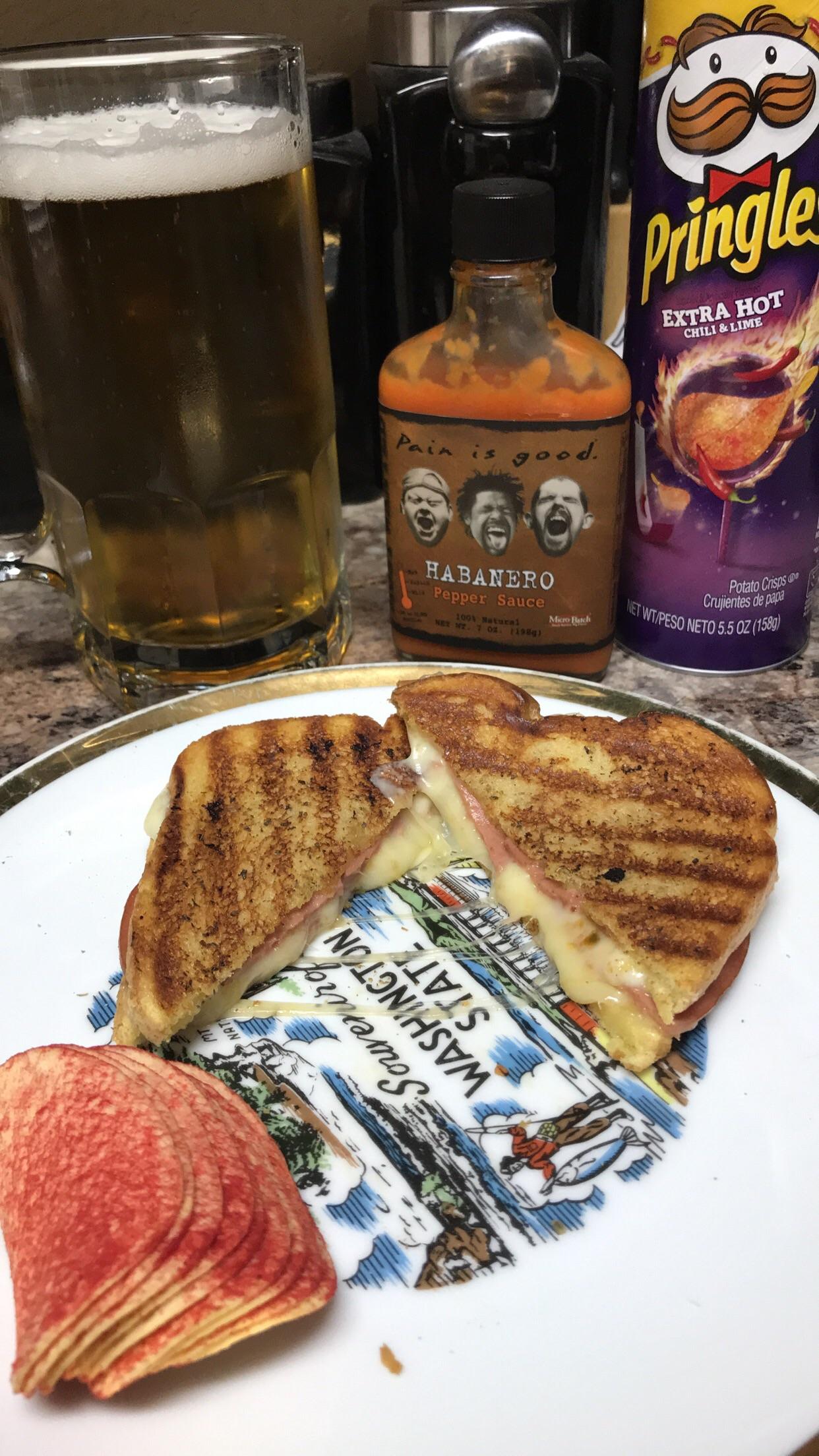 Fried bologna & triple pepper jack with ghost peppers on potato bread