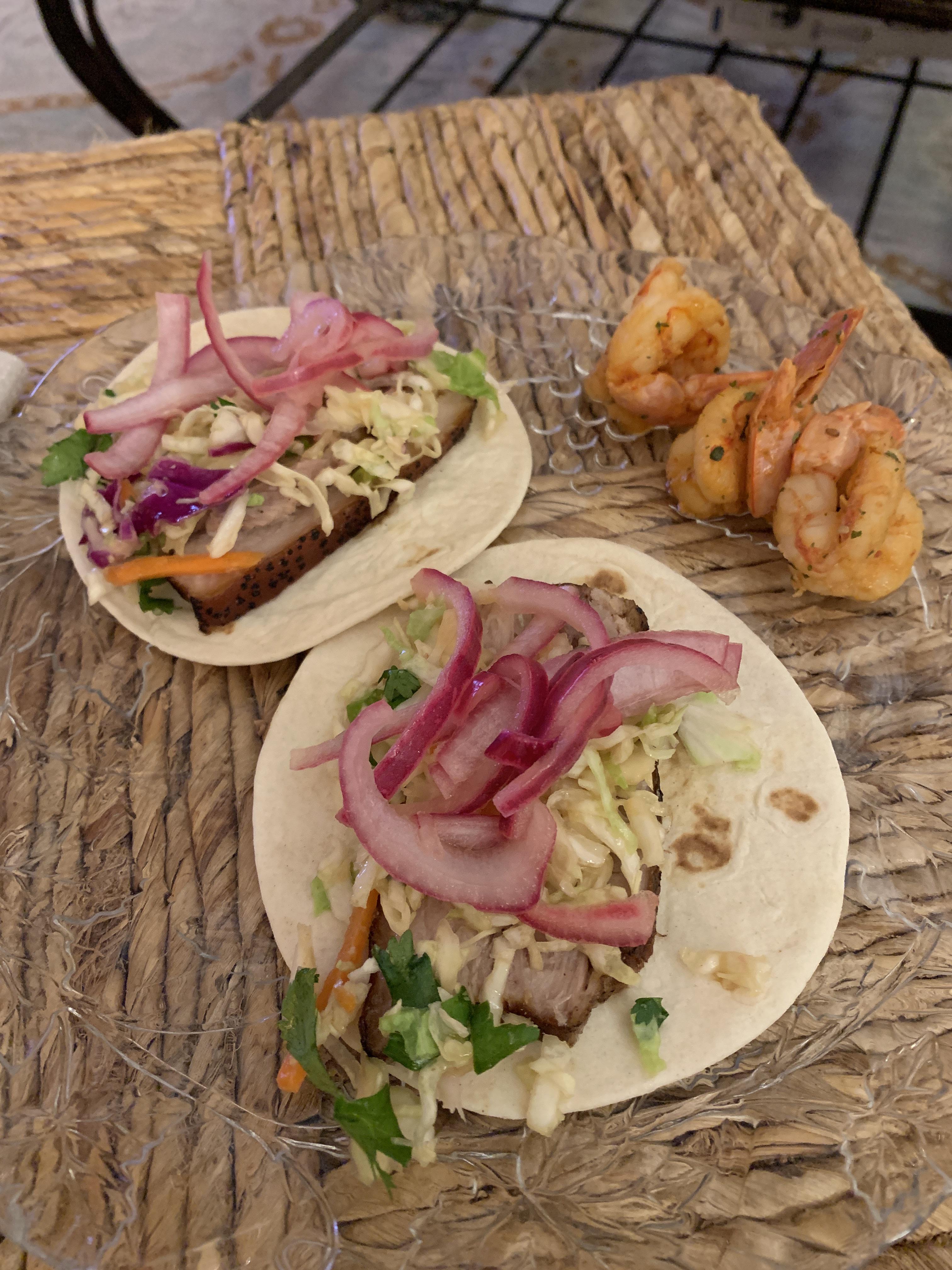 Sous vide Korean pork belly tacos topped with Asian slaw and pickled